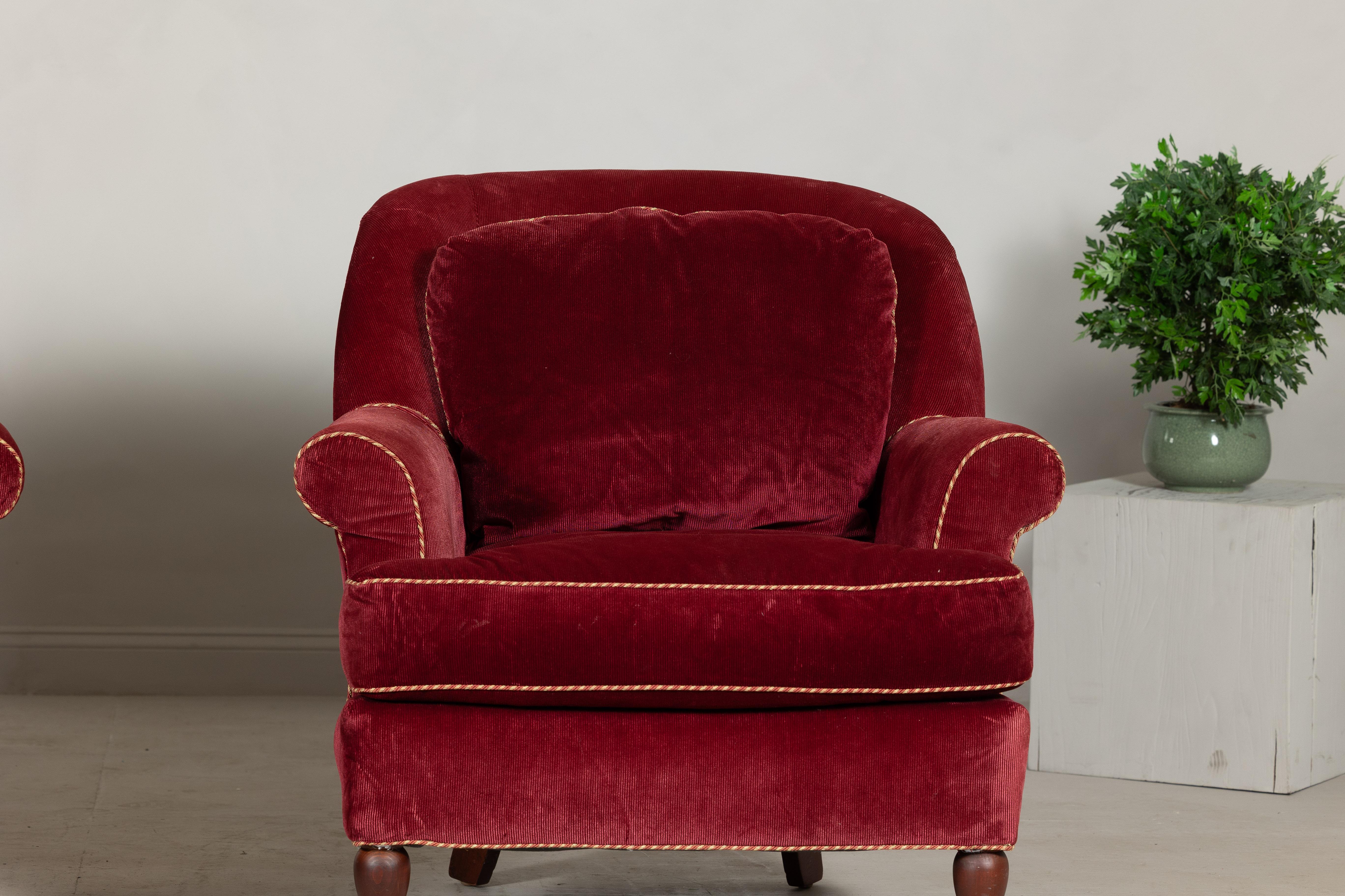 20th Century Pair of Burgundy Velvet Club Chairs with Rolled Arms and Turned Legs For Sale