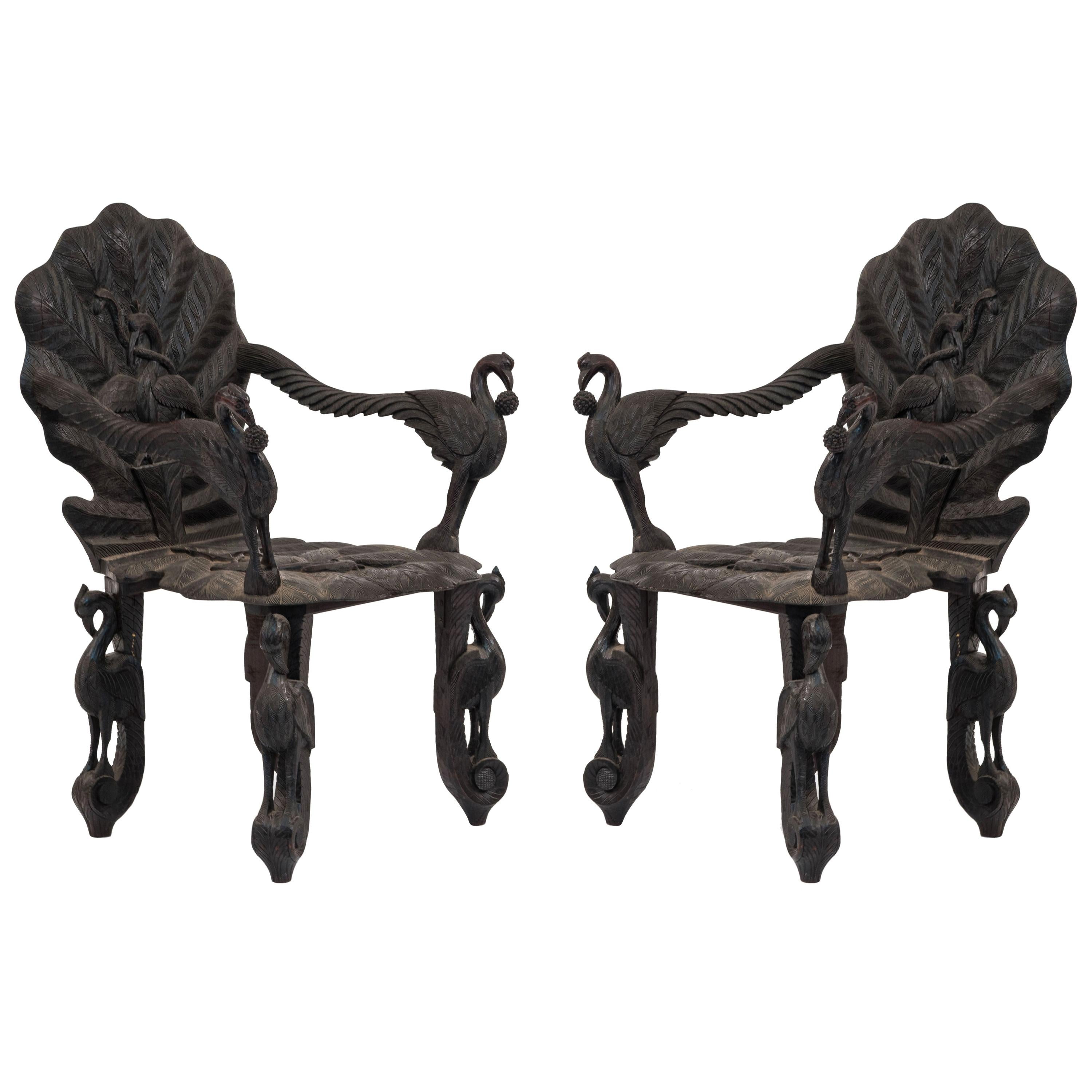 Pair of Burmese Ebonized Carved Armchairs