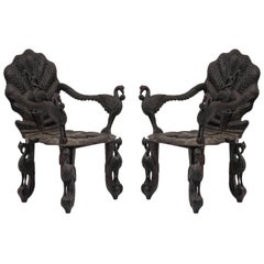 Pair of Burmese Ebonized Carved Armchairs