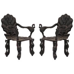 Pair of Burmese Ebonized Carved Armchairs