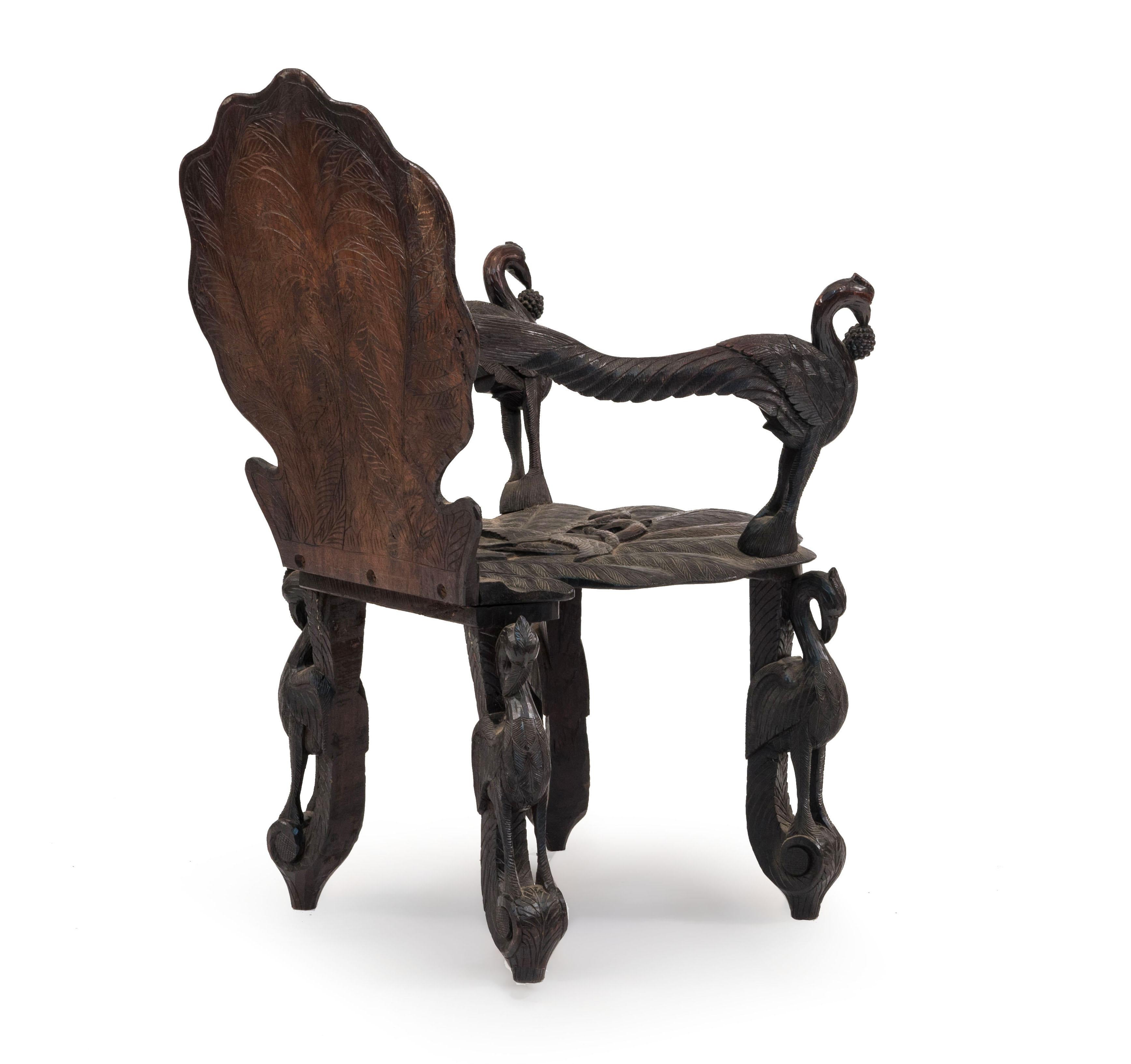19th Century Pair of Burmese Ebonized Carved Leaf and Bird Design Armchairs For Sale