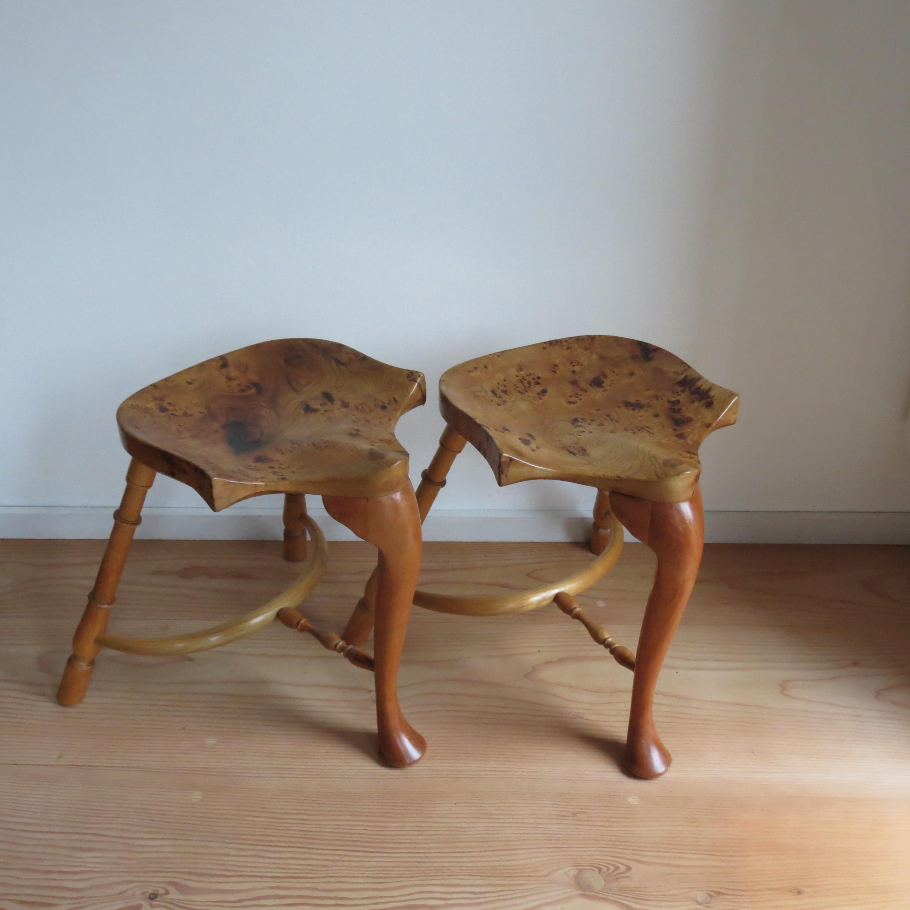 Pair of wonderful good quality hand produced bespoke stools by Stewart Linford. These date from the 1990s. The stool's wonderfully sculptural seat is made from solid Burr Ash with good figurative detail to the grain, with turned legs made from solid