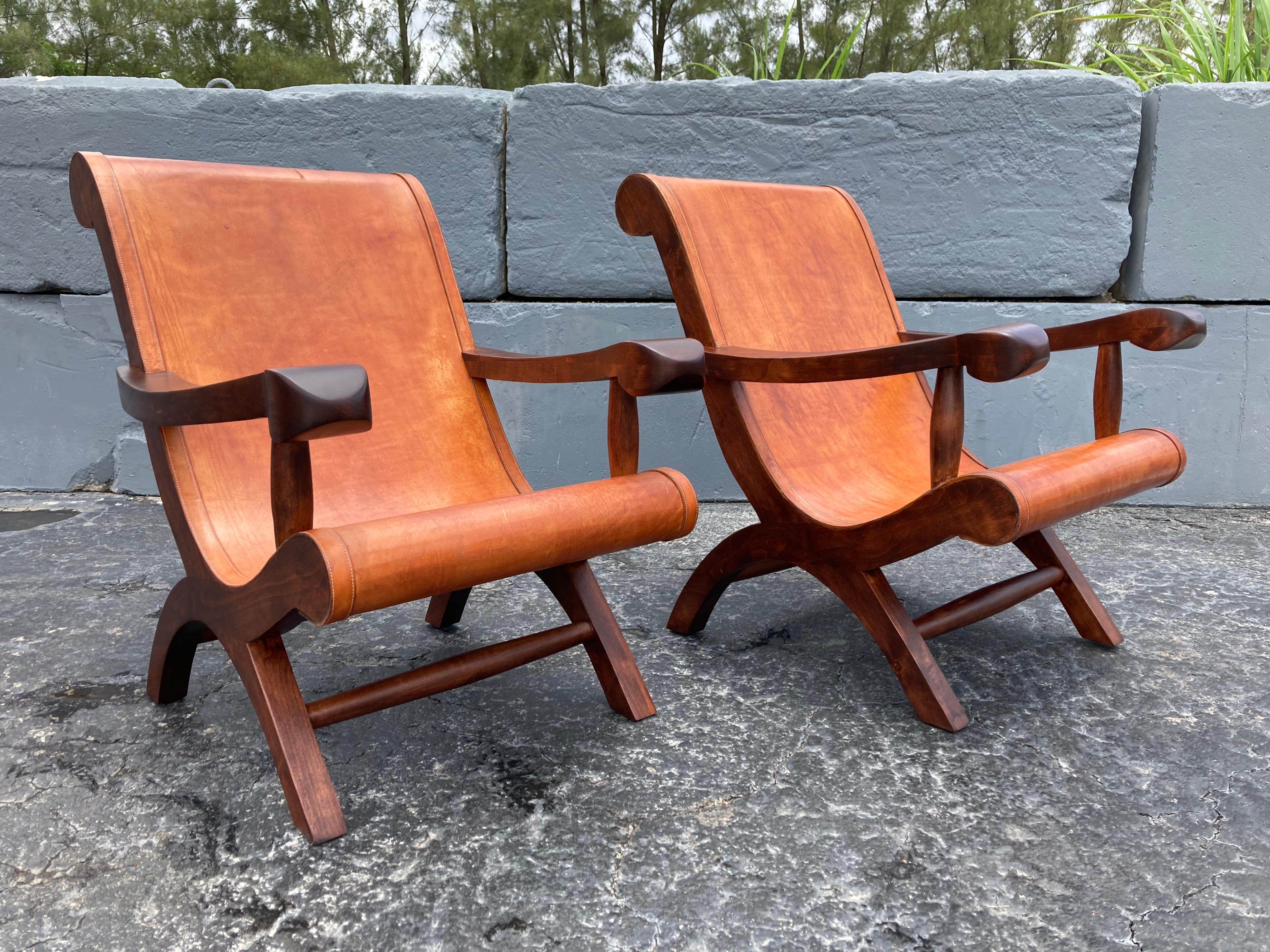 Great pair of lounge chairs, saddle leather has a great patina. Ready for a new home.