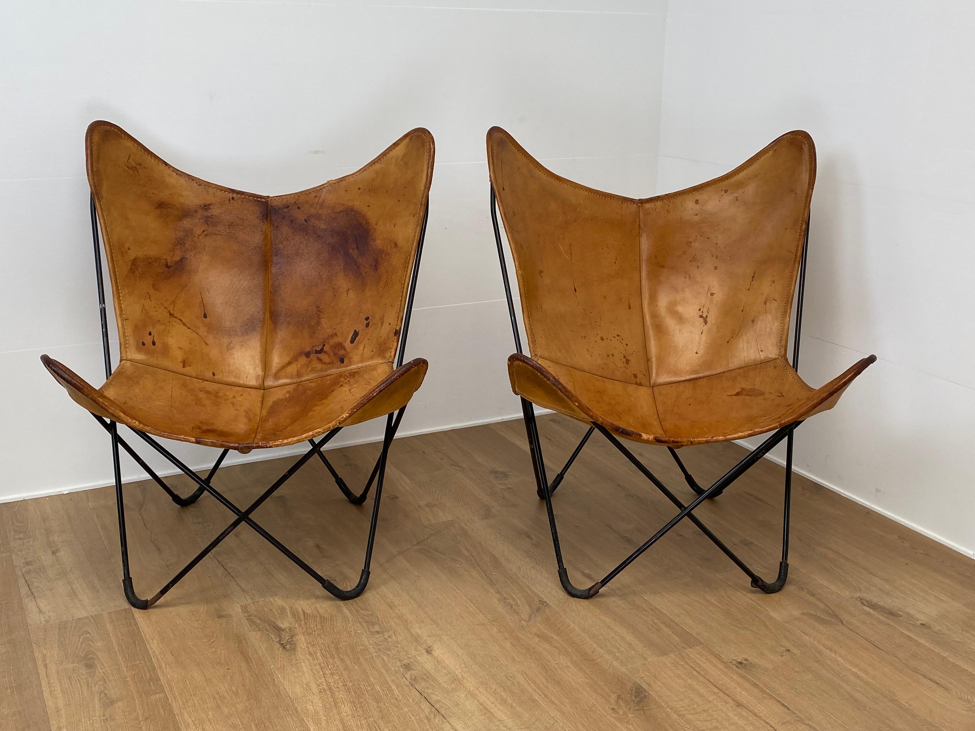 Exceptional Pair of Leather Butterfly Chairs,BKF Chairs for Knoll,
designed by Bonet,Kurchan and Ferrari in Buenos Aires in 1938,
the pair of Chairs have a beautiful Cognac Color and a great patina,
age related stains,scrathes and wear of the