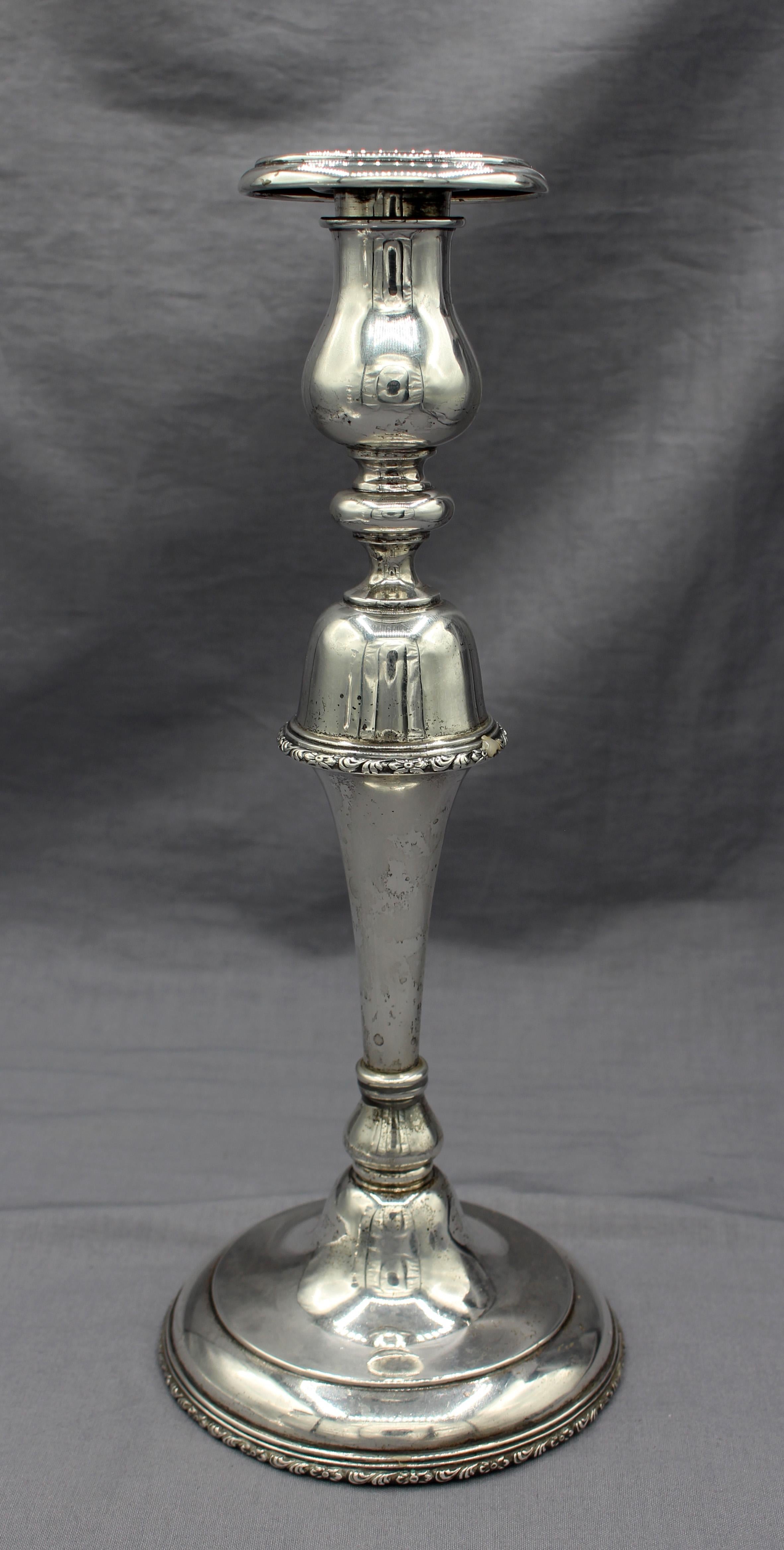 Pair of sterling silver candlesticks, American, circa 1920-30. With ingenious 