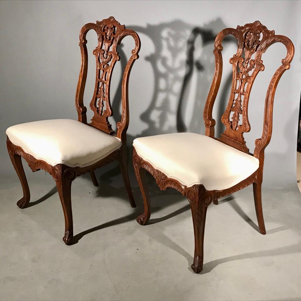 French Provincial Pair of 19th Century Carved Side or Hall Chairs in Walnut with Linen Upholstery