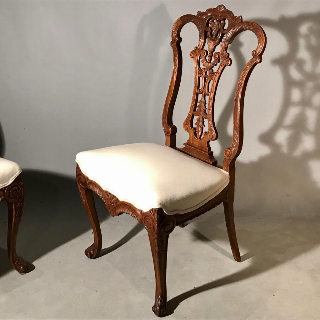 French Pair of 19th Century Carved Side or Hall Chairs in Walnut with Linen Upholstery