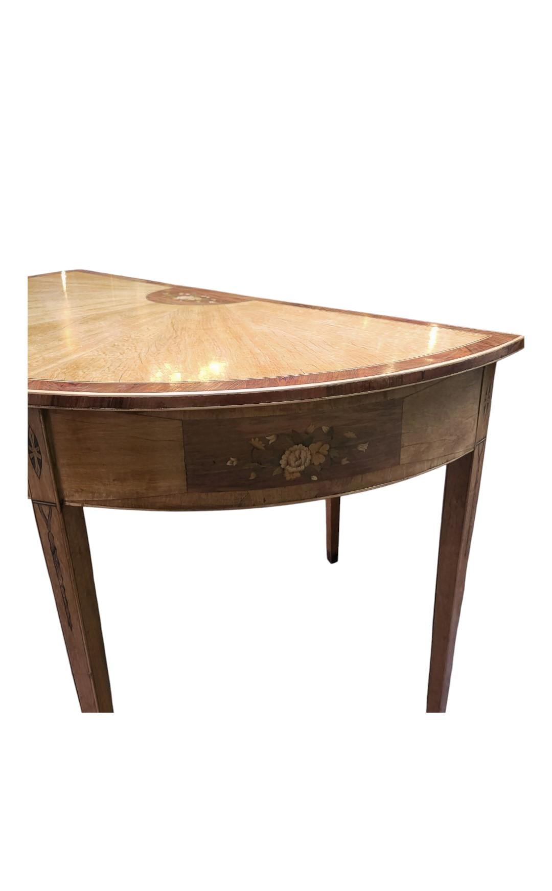 Magnificent Pair of C19th Satinwood Demi Lune Tables
Lovely Top with Inlaid Floral Decoration to the Center
These Tables Date C1870s in the Sheraton Style