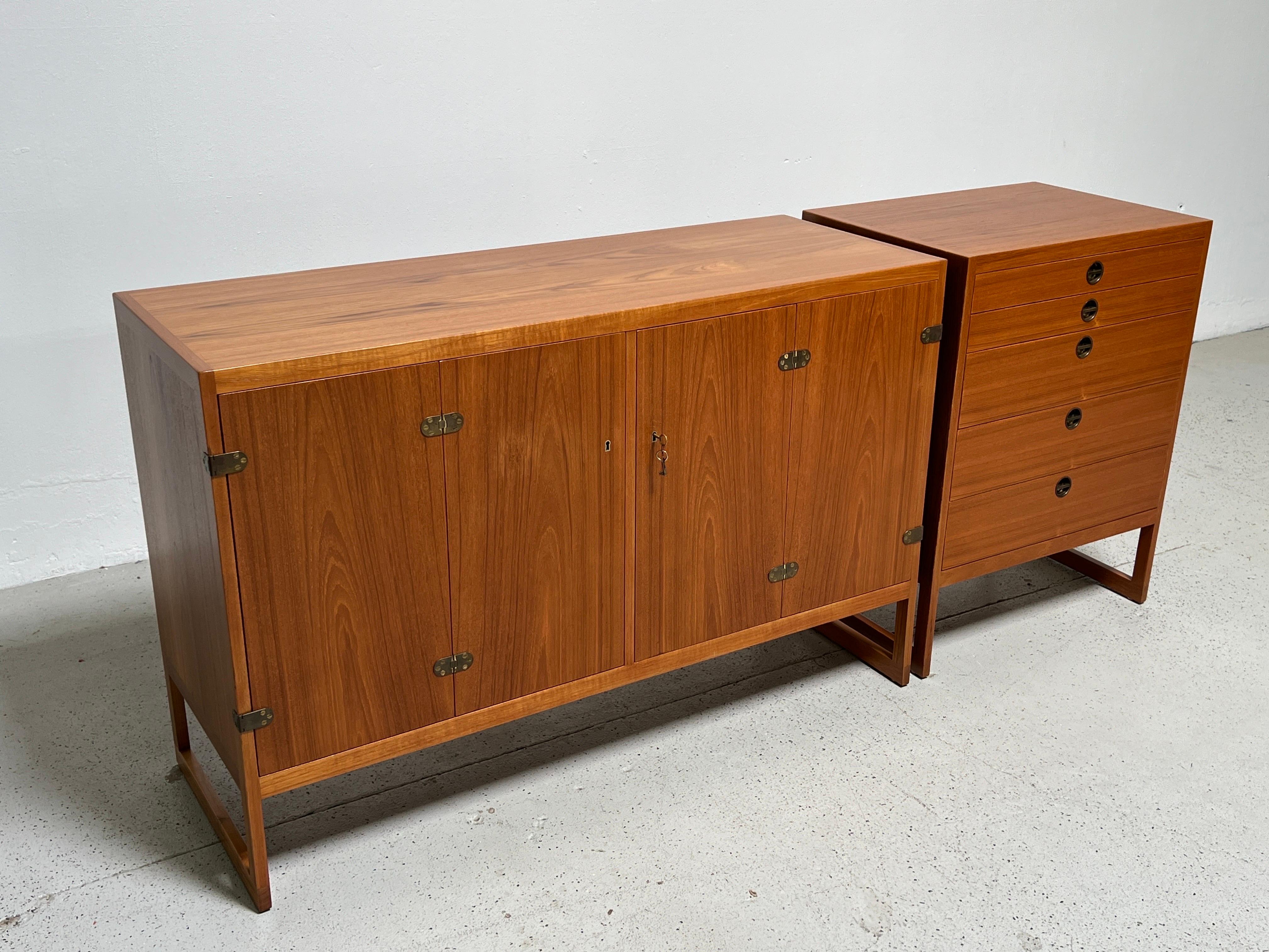 A pair of teak cabinets designed by Børge Mogensen 1957, manufactured by cabinetmaker P. Lauritsen & Son. 
Measures: Large cabinet: 54.25
