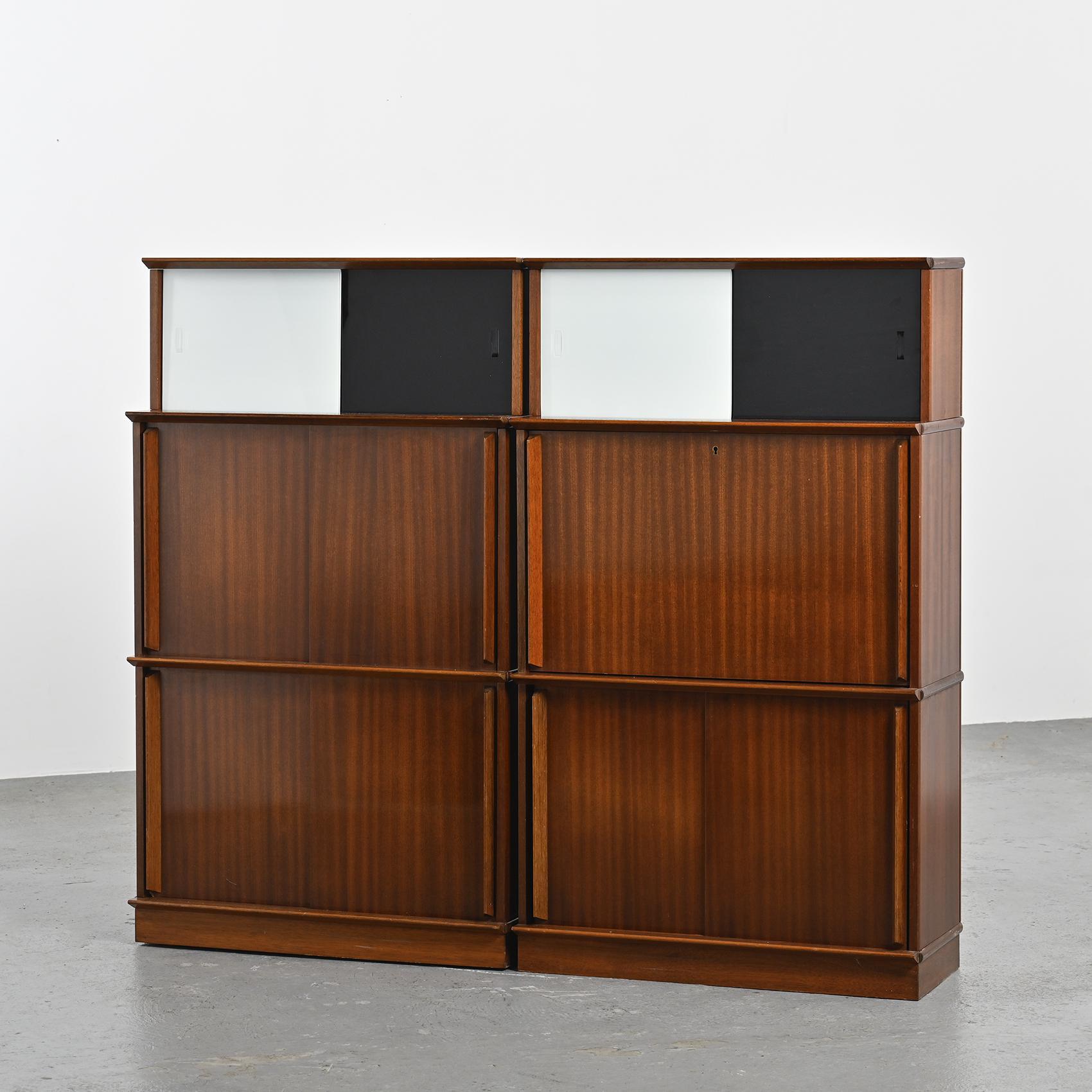 Pair of bookcases dating from the 1950s, by Didier Rozaffy for the French manufacturing company Oscar, known for its modular bookcases and furniture.

During this period, Oscar furniture was innovative, characterized by its adaptability, with