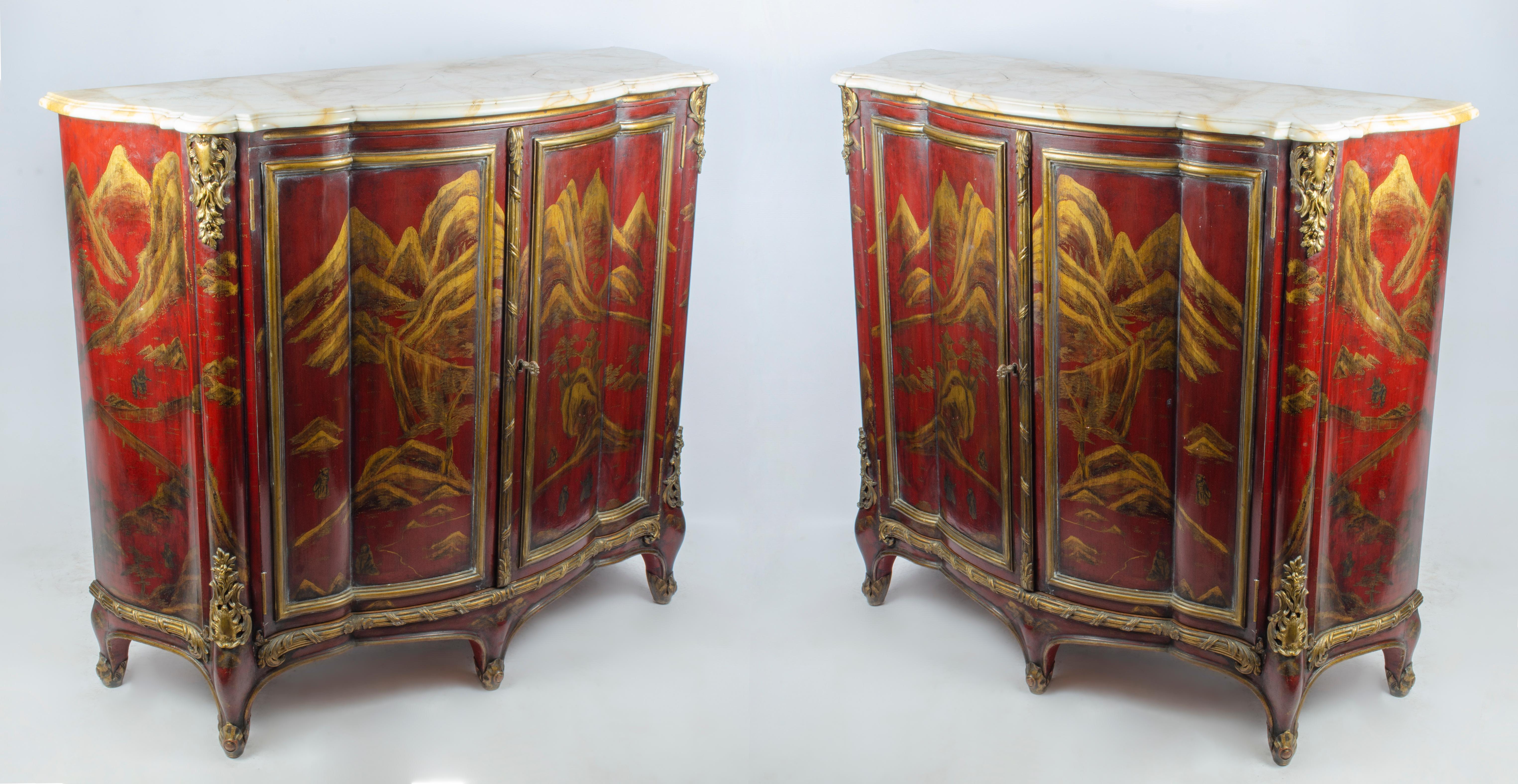 Pair of red lacquered cabinets with chinoiserie designs in gold, with bronze details and European marble top and interior with shelf. Made by Maison Jansen (1880-1989). Signed Jansen.

France, CIRCA 1930.