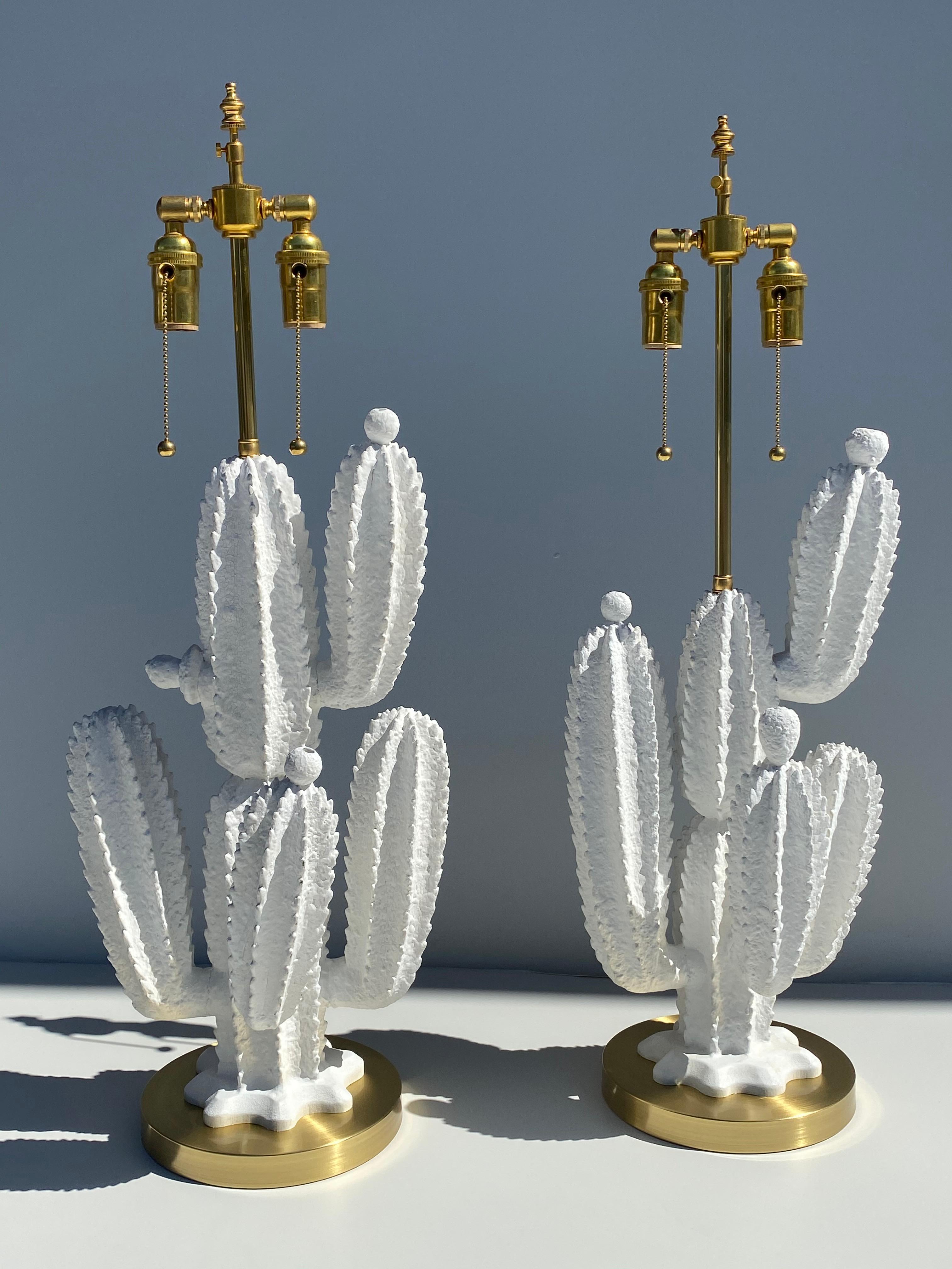 Pair of plaster over hand carved wood Saguaro cactus lamps on brass bases.