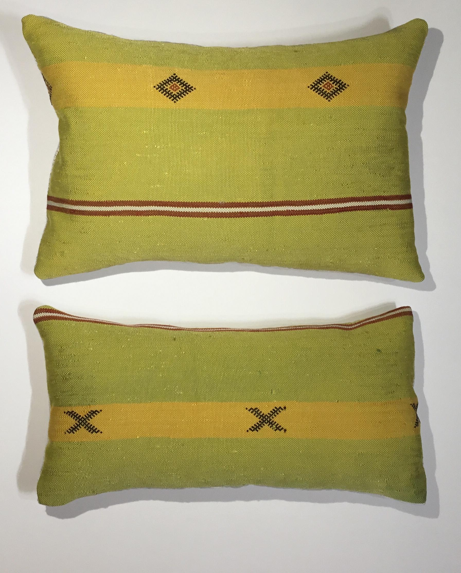 Beautiful pair of pillows made of handwoven flat-weave Kilim textile fragment, with geometric motifs, unusual funky colors of black muster and vibrant. Lime, fine cotton backing, frash new inserts.
Sizes:
18.5” x 9”
19” x 12.5”.