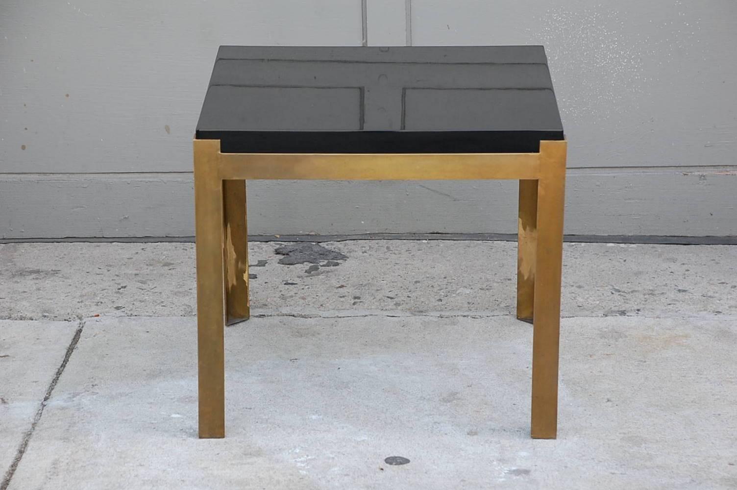 Pair of 'Caisson' lacquer and patinated brass side tables by Design Frères.
This pair is in stock and ready for install.
Chic and understated.