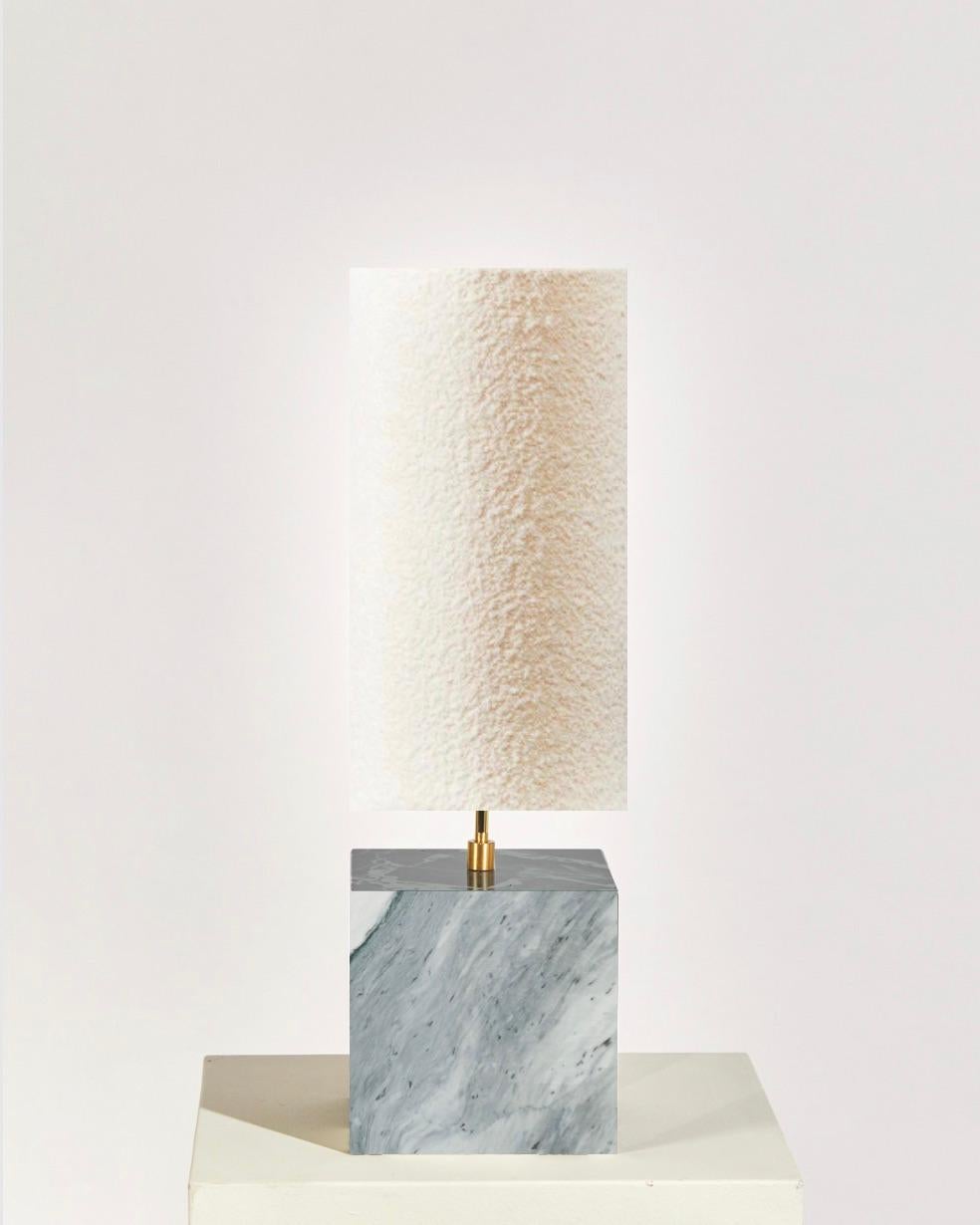 A rare and unique pair of Calacatta Turquoise Small Table Lamps with Boucle Shades with brass hardware. Brass dimmer on back face allows for expert light setting. 

The Coexist table lamp consists of a marble cube base and in this edition, the lamp