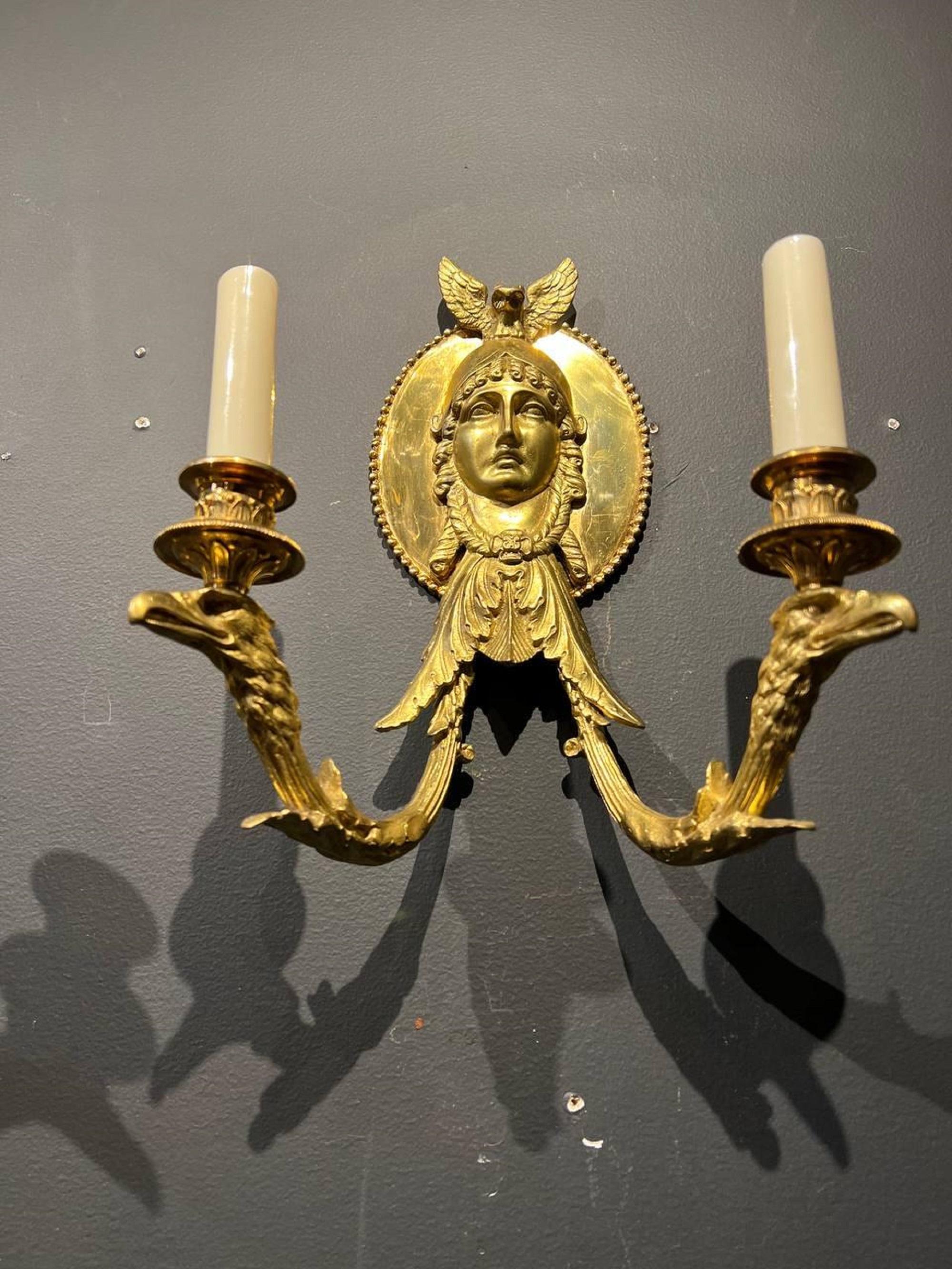 A pair of 1920’s Caldwell Empire style sconces woman face on plate, owl on top and eagle heads on arms for two lights. Available 3 pair price per pair.
Dealer: G302YP