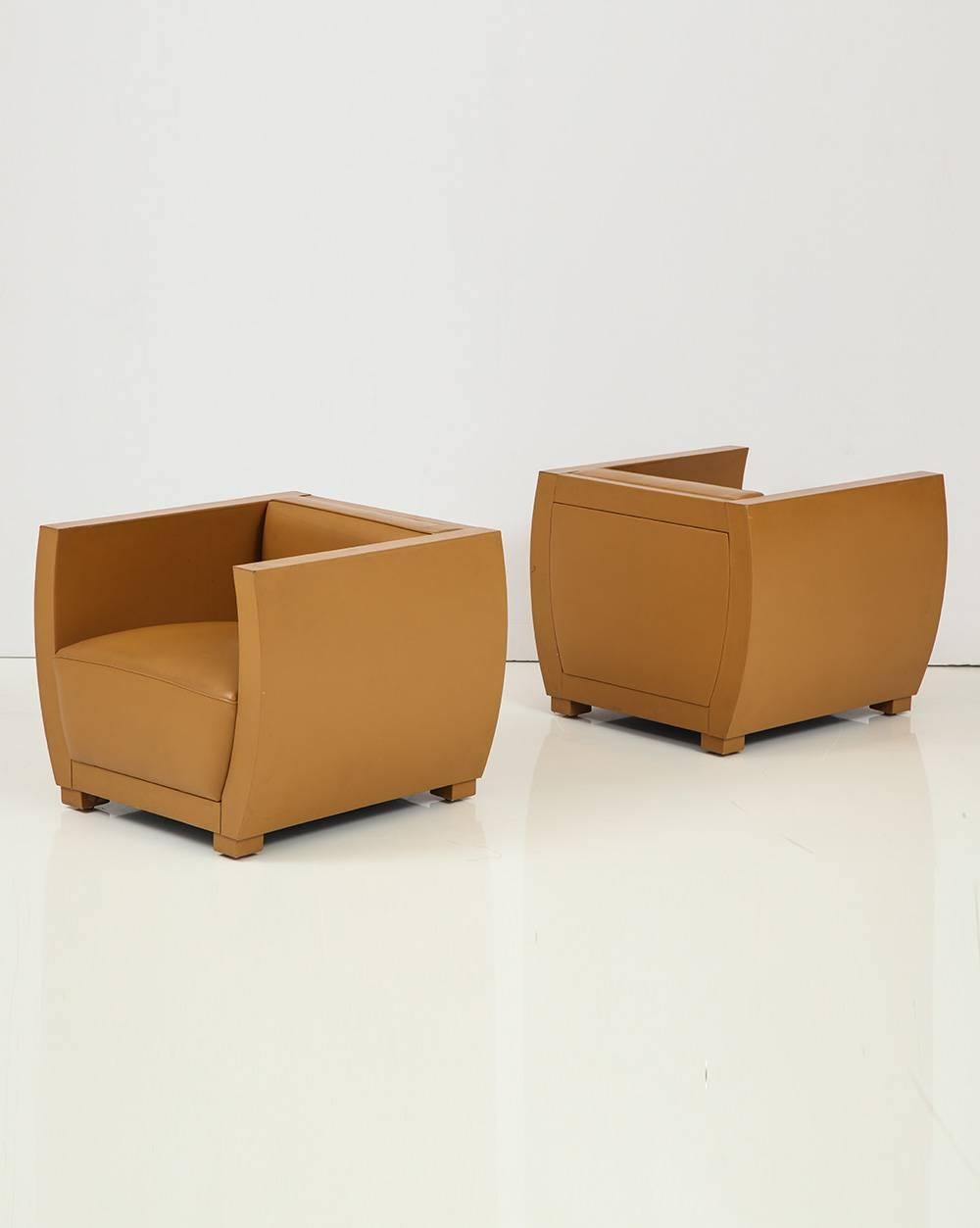 Pair of camel colored leather clad club chairs.
American, circa 1990.
