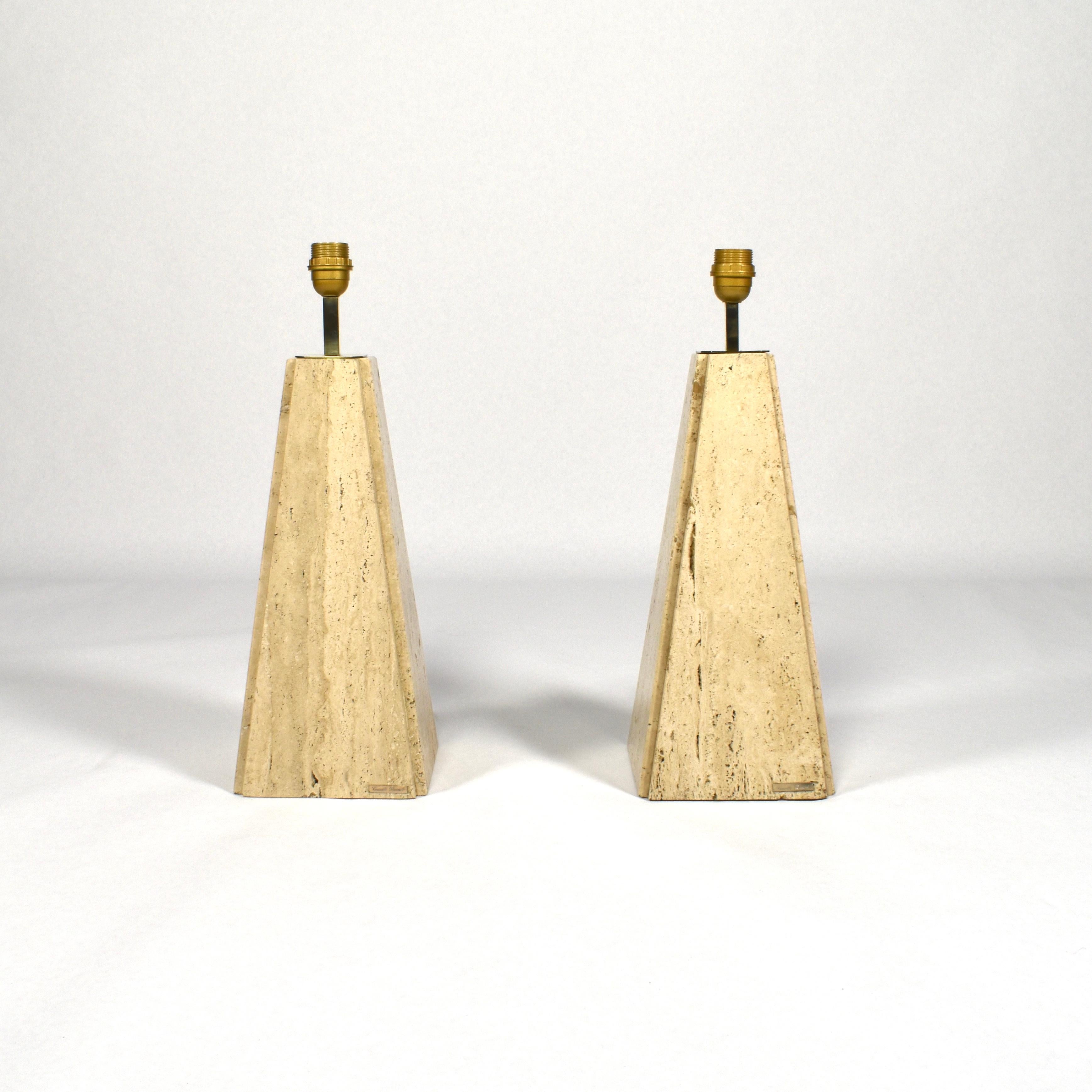 Elegant pair of Camille Breesch table lamps in travertine and brass. The lamps still remain in excellent condition and are signed with label.

Designer: Camille Breesch

Country: Belgium

Model: Table lamps

Material: Travertine / Brass

Period: