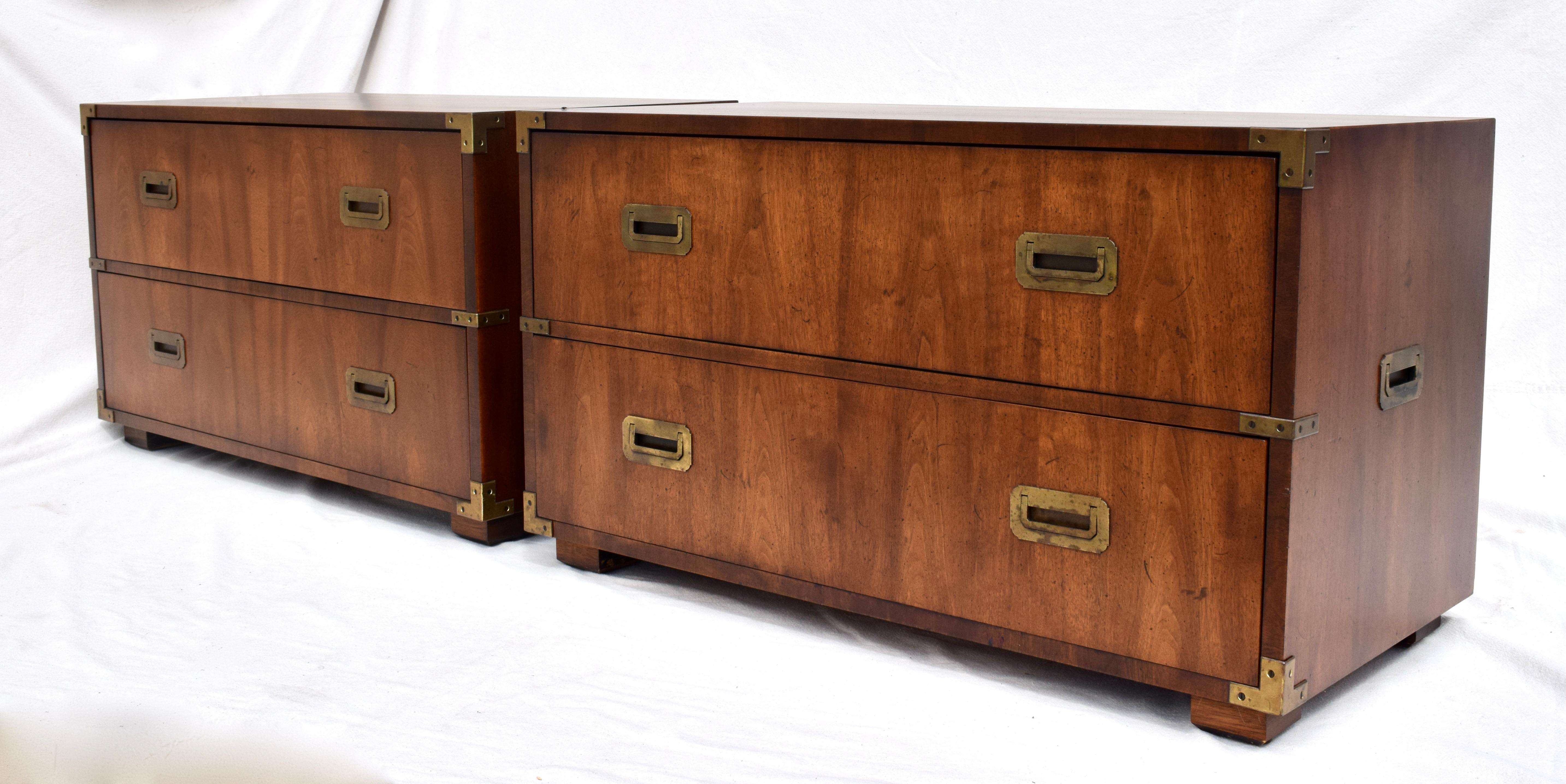 Pair of Henredon flame Mahogany Campaign chests each having two spacious drawers complete with removable drawer inserts. Aesthetic, functional symmetry suitable for placement in a variety of settings.