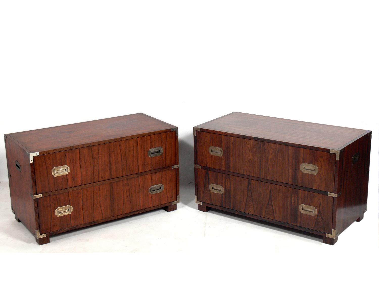 Pair of rosewood Campaign chests, circa 1960s. They are a versatile size and can be used as chests or nightstands in a bedroom, or as side or end tables in a living area. The price of $2200 listed below is for the pair of chests. If you would like