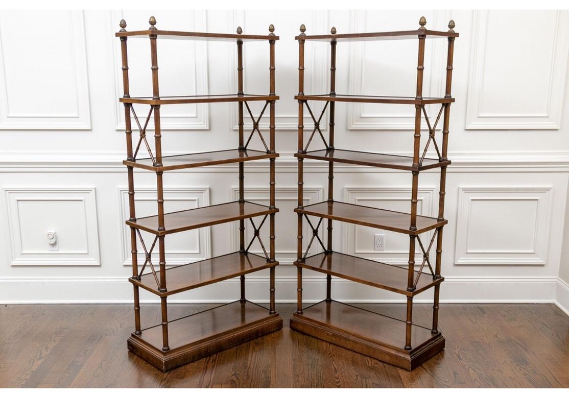In a walnut finish with five shelves with outer moldings and X form side supports on alternate tiers. Carved bases and fine brass artichoke finials. 
Measures: Height 73