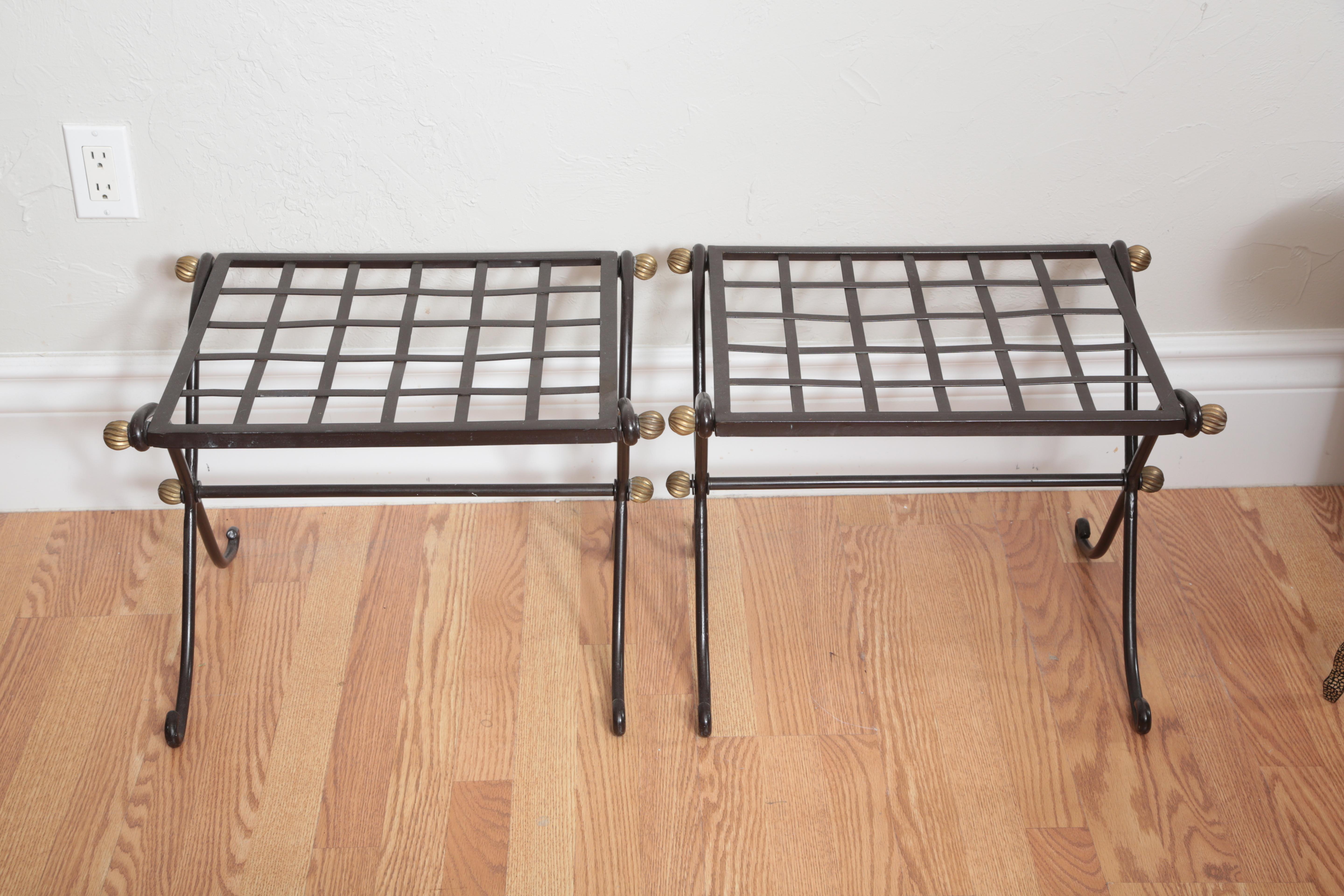 Pair of iron lattice top benches with brass trim. They would also make great luggage racks.