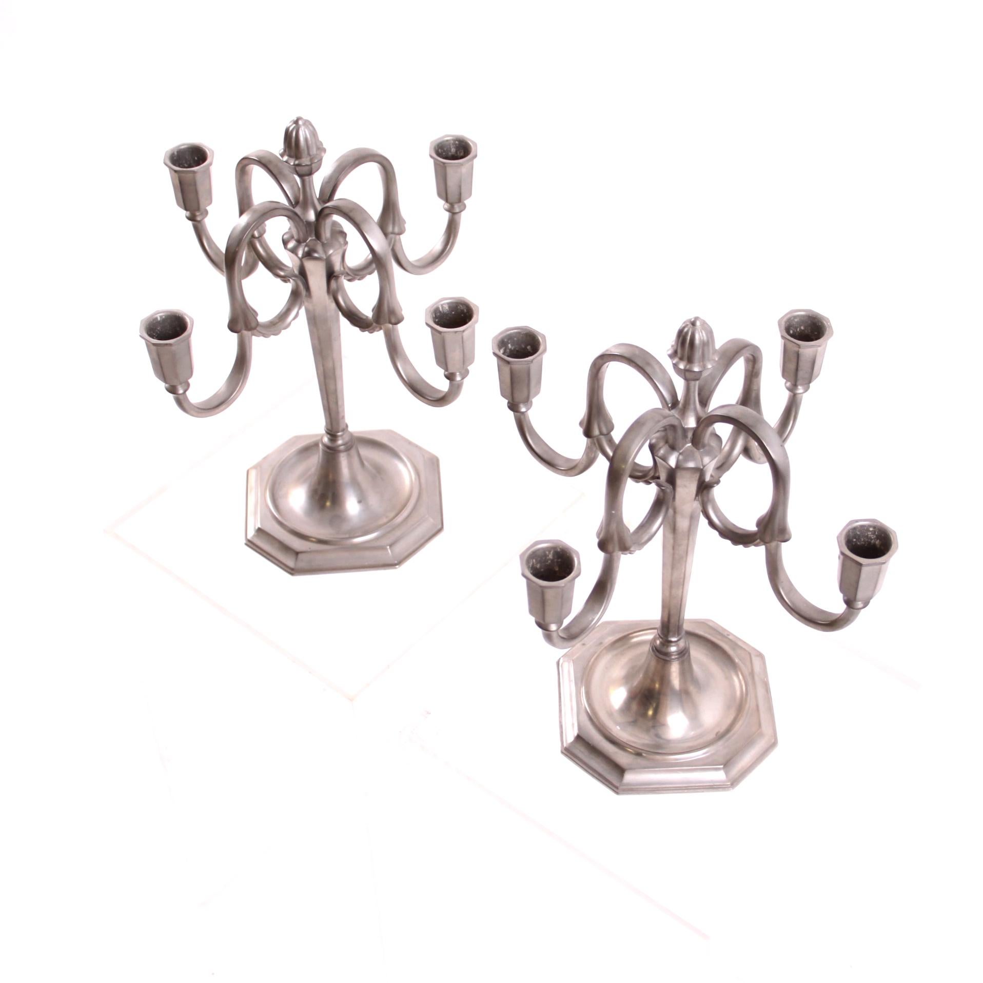 JL Hultman & Svenskt Tenn - Scandinavian Modern

A beautiful pair of pewter candelabras with four candle arms each, designed by JL Hultman for Svenskt Tenn, Sweden 1930s. 

Stamped with manufacturer's mark. JLH SVENSKT TENN

The pair of