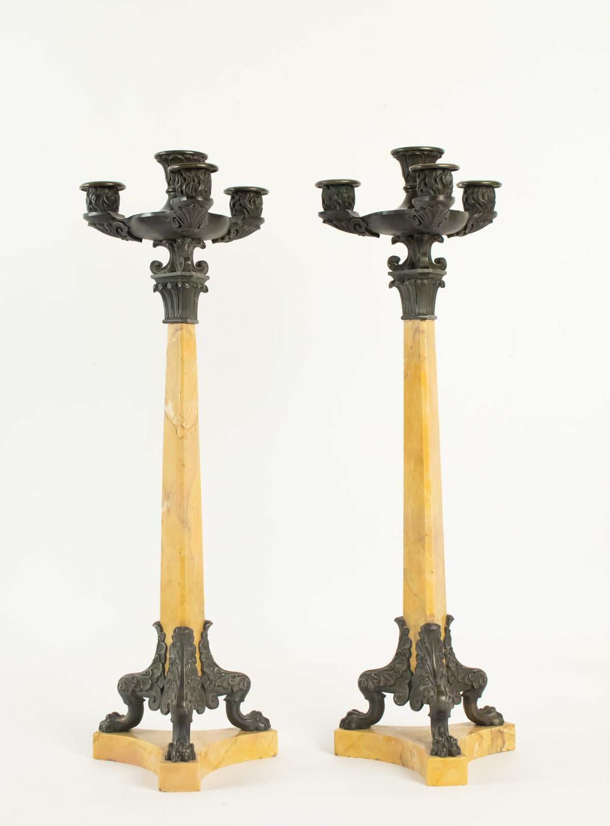 Pair of candelabra period restoration Siena yellow marble and patinated bronze, 19th century, 4 fires. 
Measures: H 55cm, D 18cm.