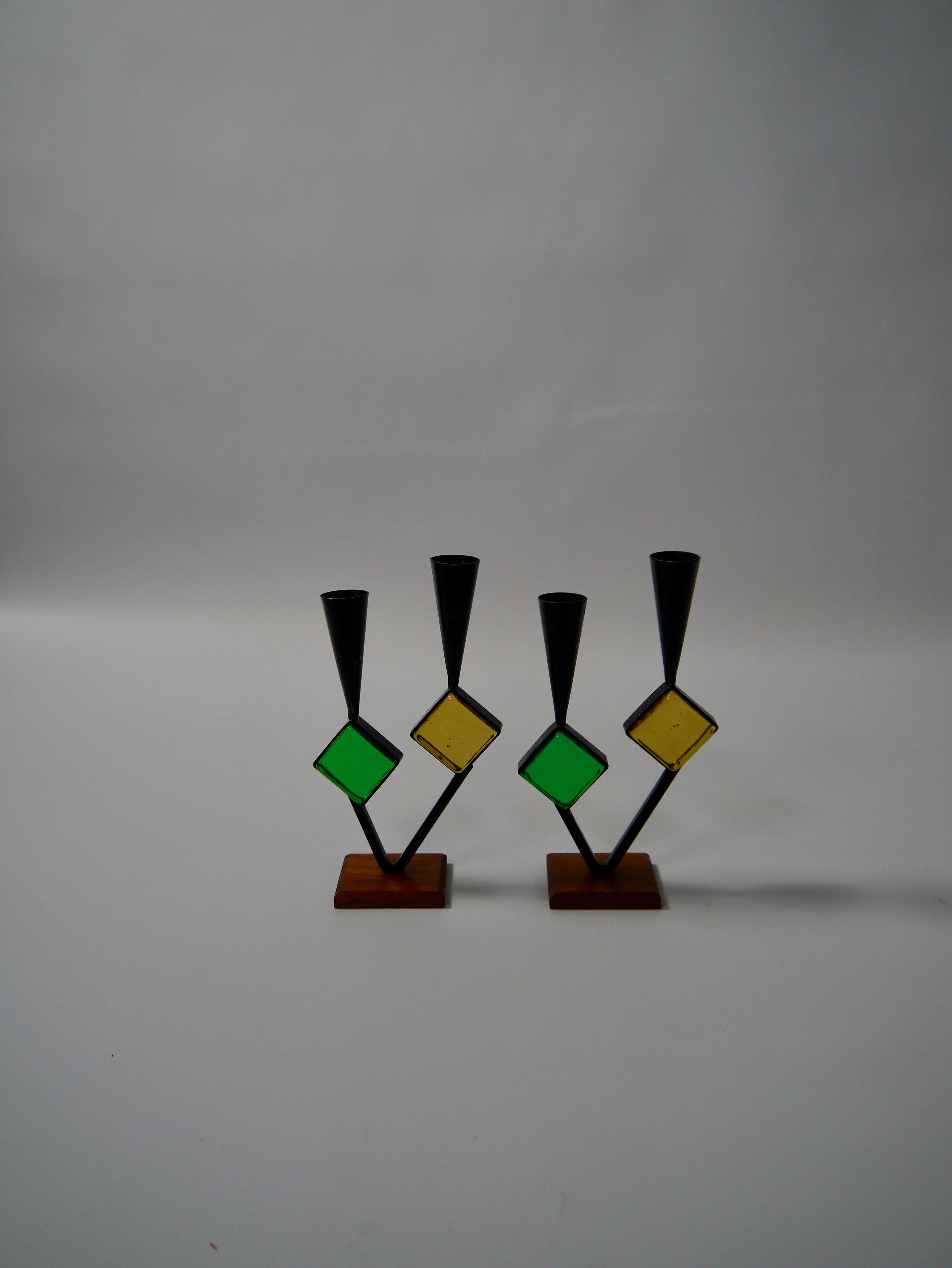 Pair of candelabras designed by Erik Höglund for Bo Svensk. Cast iron, teak base and art glass inlays. Marked no 249.