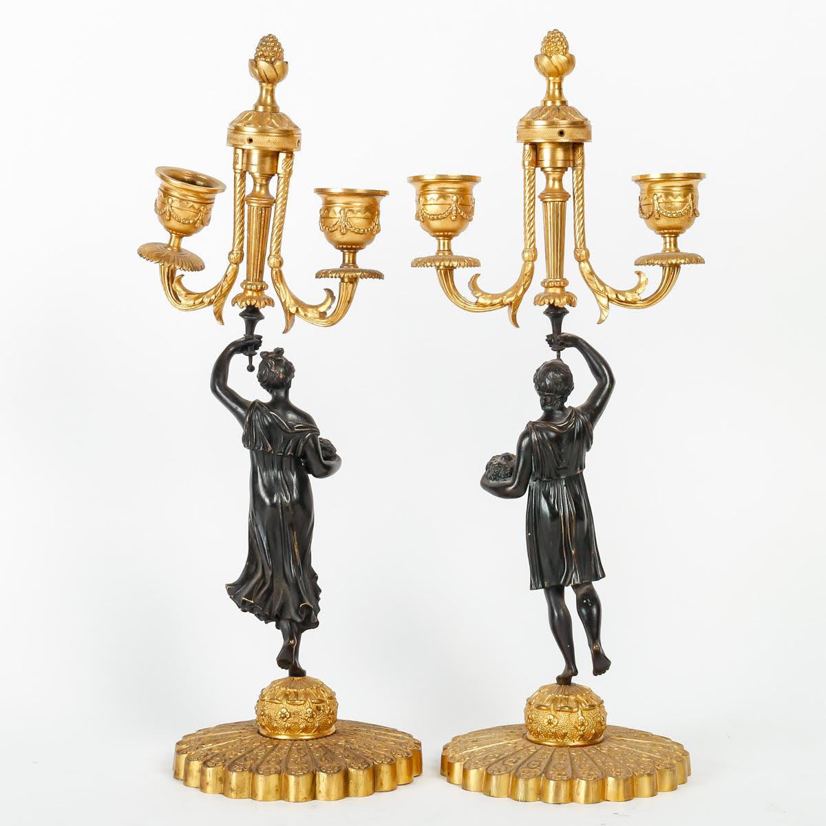 Pair of Candelabras in Patinated and Gilded Bronze, Charles X period.

Pair of Charles X period Candelabras, 19th century in patinated and gilded bronze.

Dimensions: H: 37cm, W: 15cm, D: 12cm