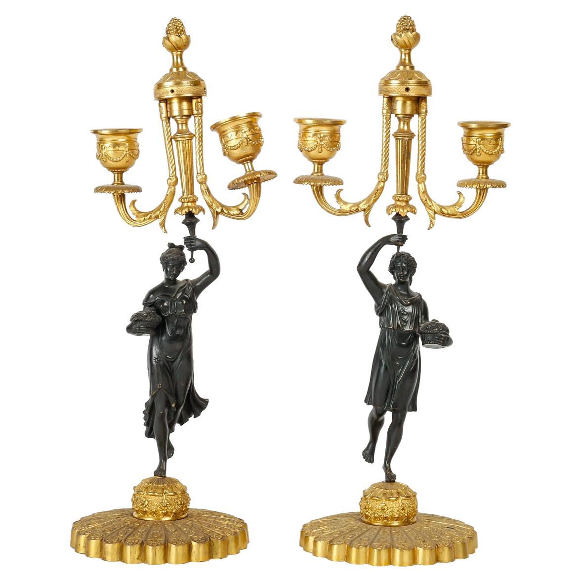  Pair of Candelabras in Patinated and Gilded Bronze, Charles X Period. For Sale