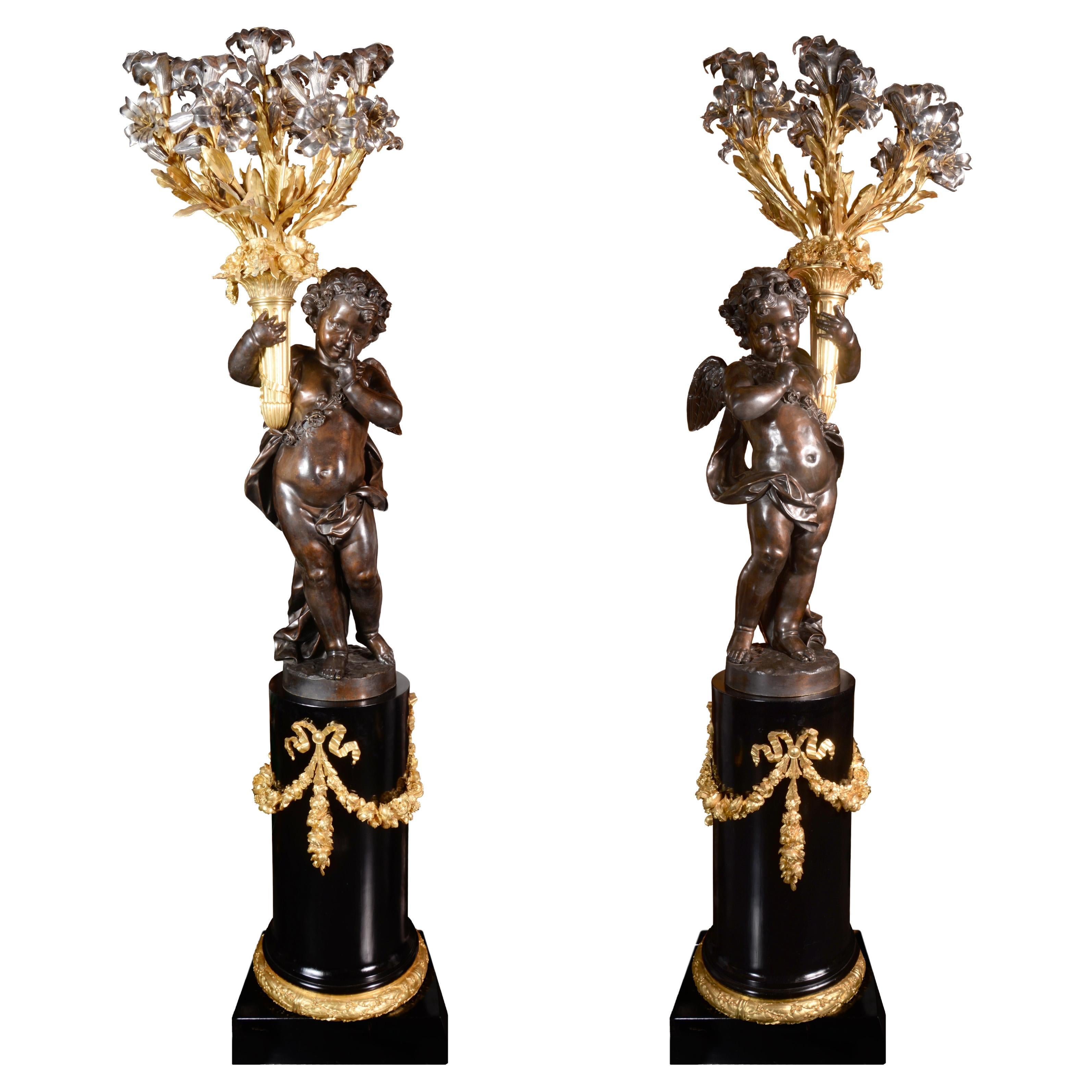 Coppia di candelabri a 9 luci in bronzo dorato, argentato e brunito in vendita