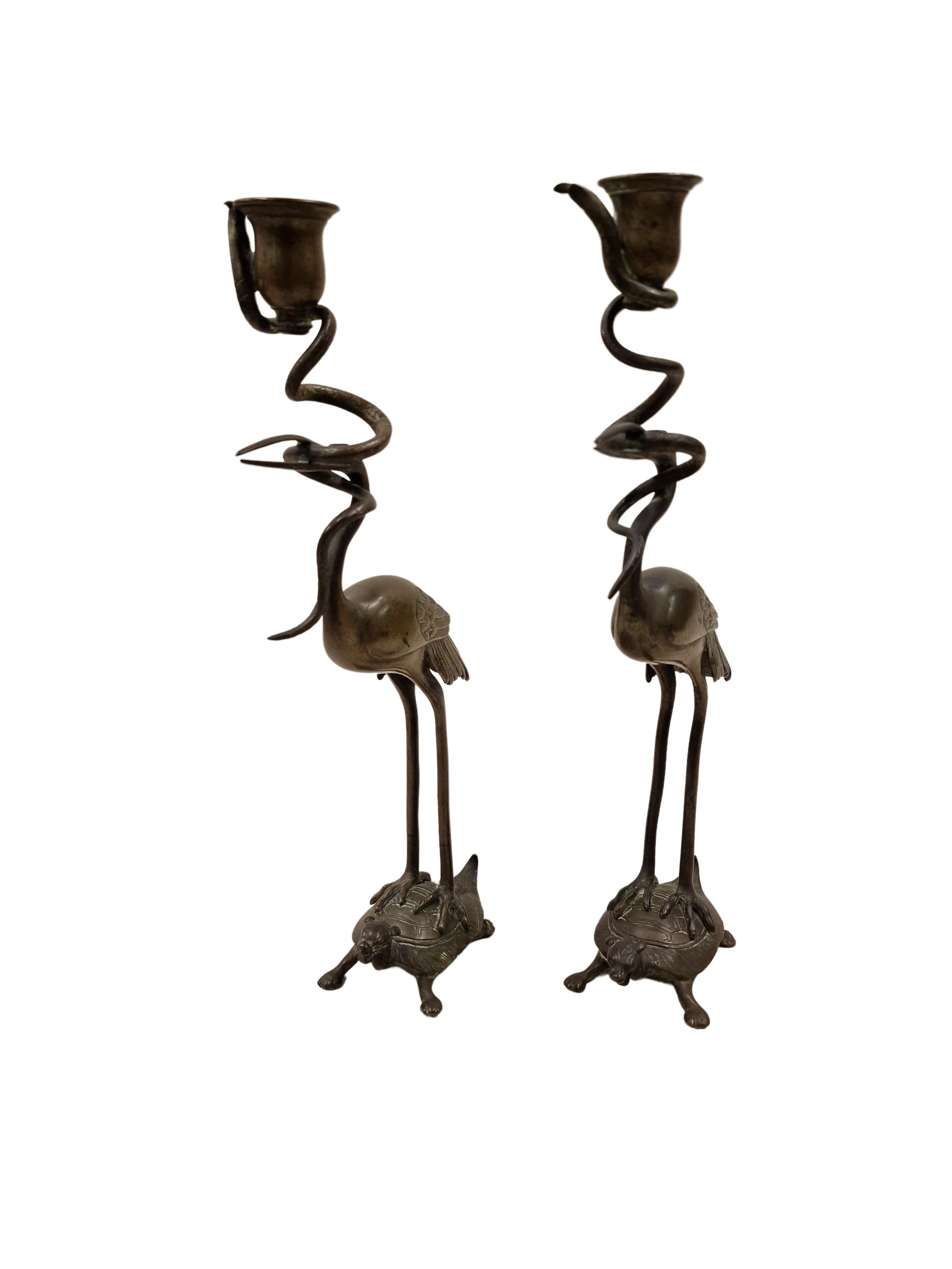 Pair of figural candlesticks, made out of bronze from the Napoleon III era, datable in the 1880s, from France. These two candlesticks are an excellent example of a french high quality bronze work. 
About the design: Two stylized turtles serve as a