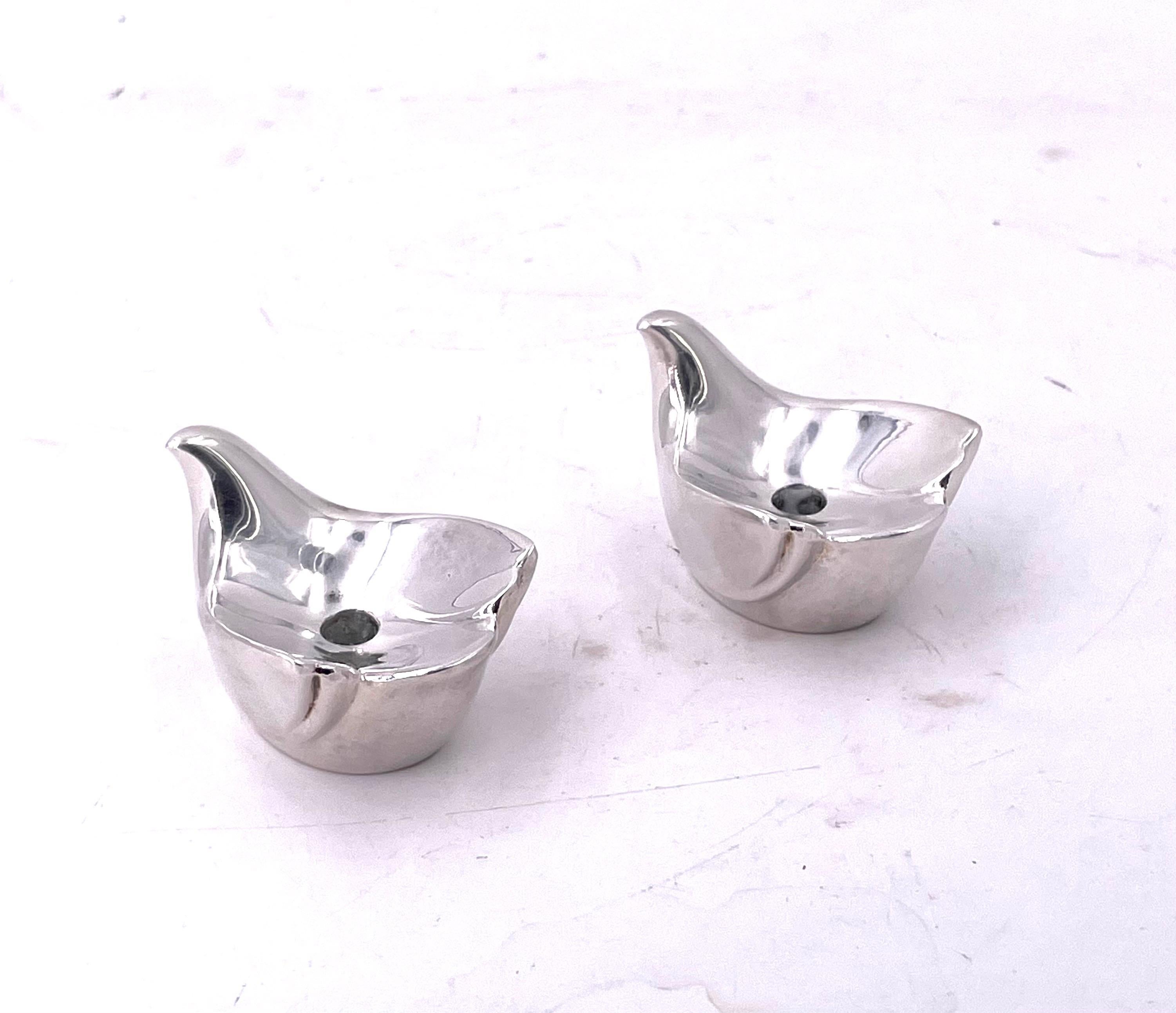 Beautiful, elegant pair of silver-plated love birds designed by Gunnar Cyren for Dansk circa 1980's it takes a thin tapered candle 1/4