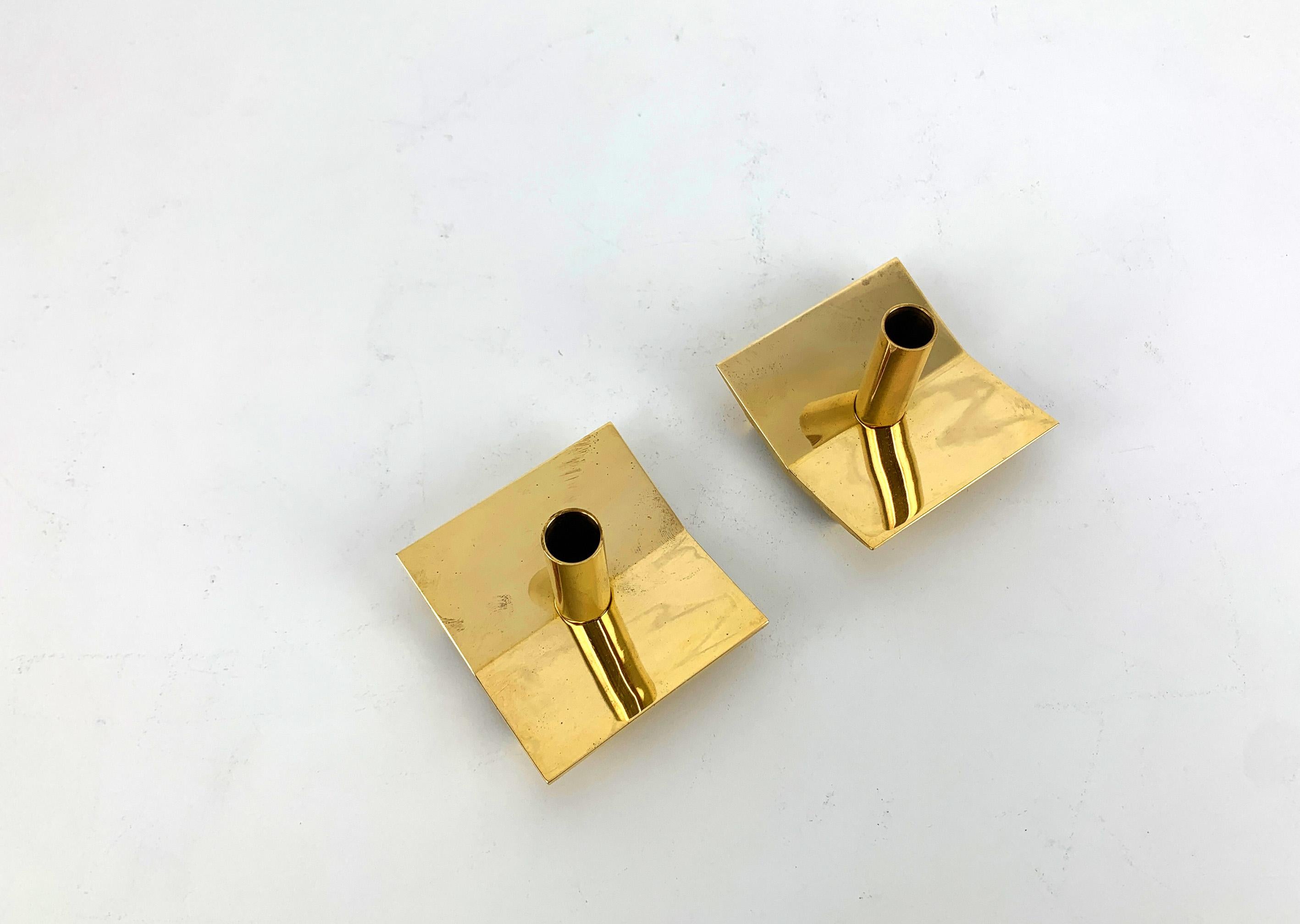 Pair of candle-holders model N°70 for 1 candle by Pierre Forssell, made of solid brass. 

Designed by Pierre Forssell and manufactured in Sweden by Skultuna. The company was founded by King Carl IX of Sweden in 1607. Pierre Forsell worked between