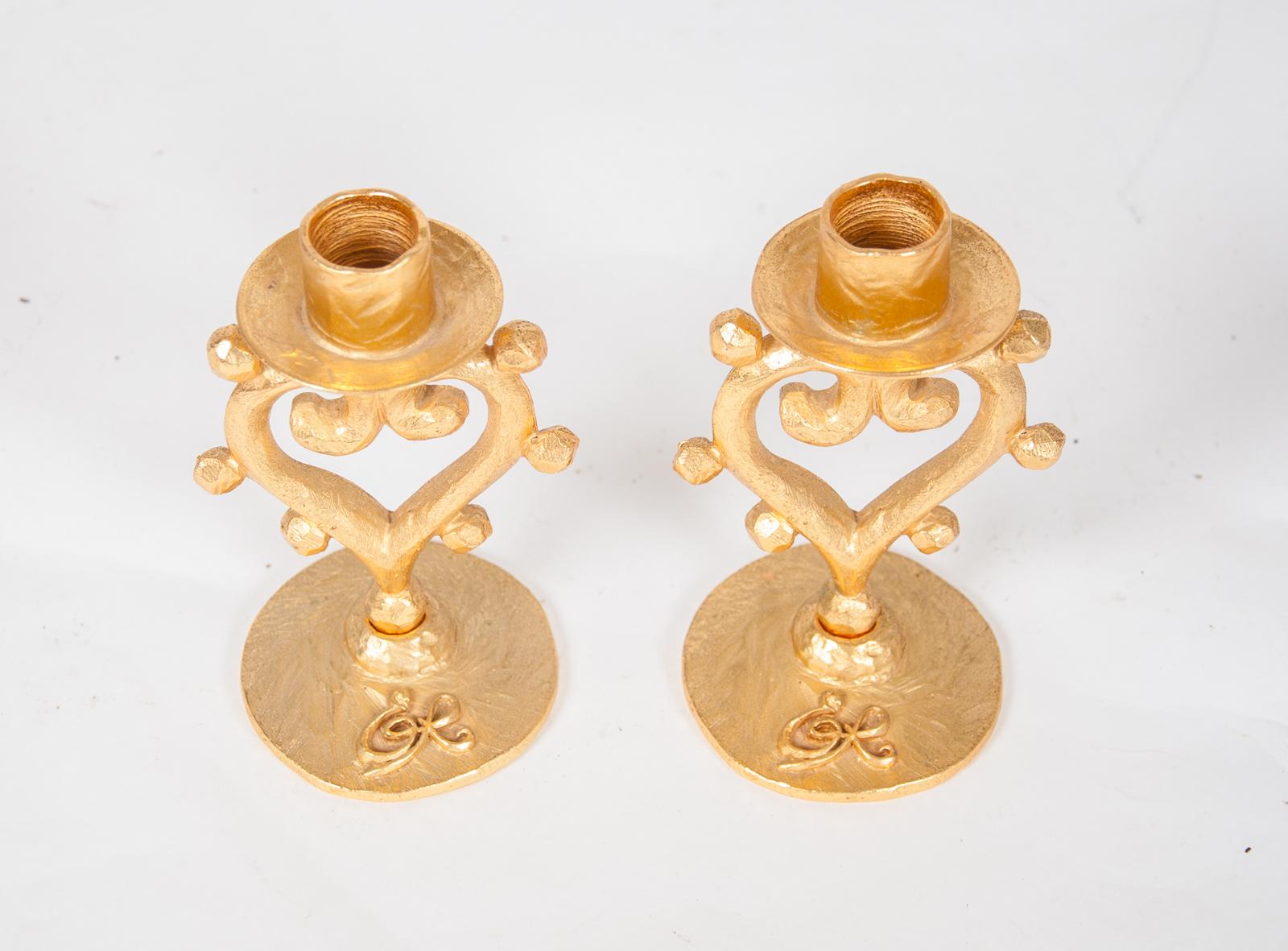 Playful pair of gilt bronze candlesticks by Edouard Rambaud

Stamped to the base “Edouard Rambaud – Paris”

France, circa 1980

 

Edouard Rambaud was a 1980s designer famous for his use of hearts, suns, stars, and crosses in his