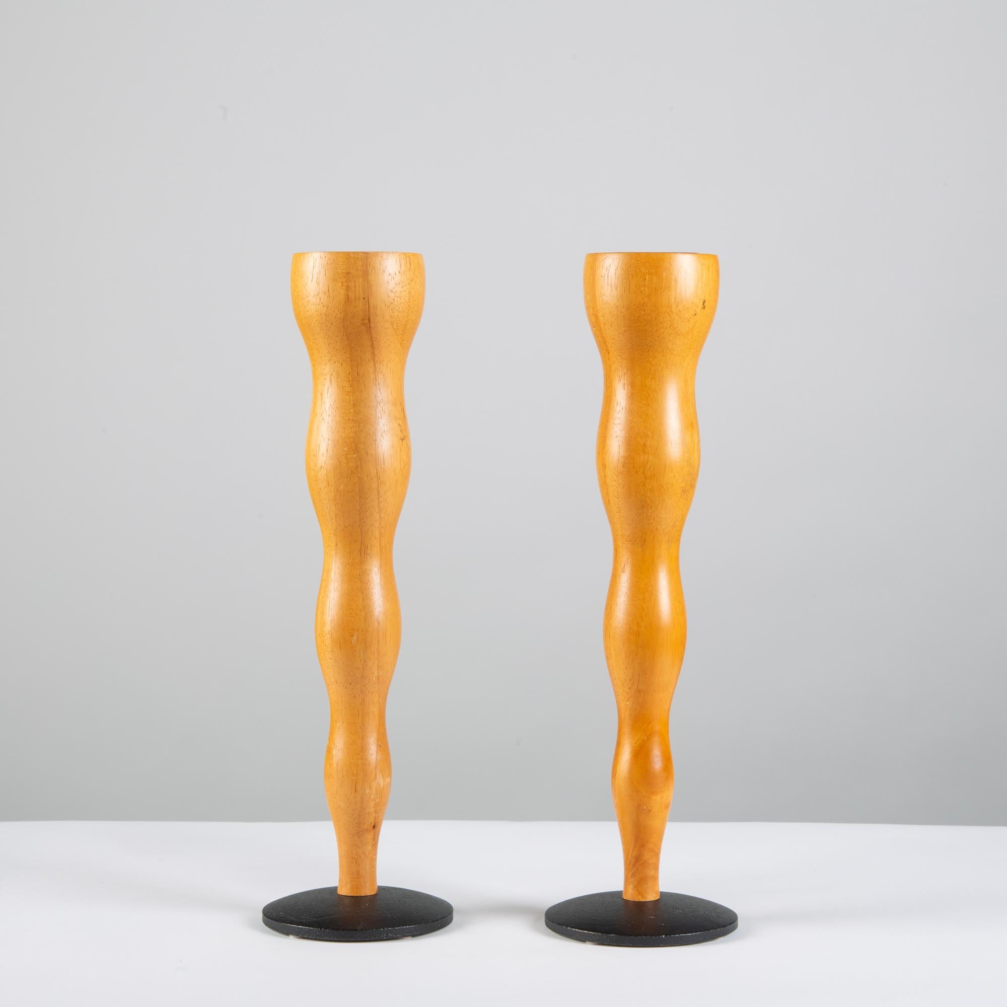 Pair of maple candlesticks, by Mikael Björnstjerna for Boda Nova c.1960s, Sweden. The pair of beautifully hand sculpted candlesticks have a round black metal base.

Marked - Boda Nova Sweden Mikael Björnstjerna on the underside

Dimensions: 4.75