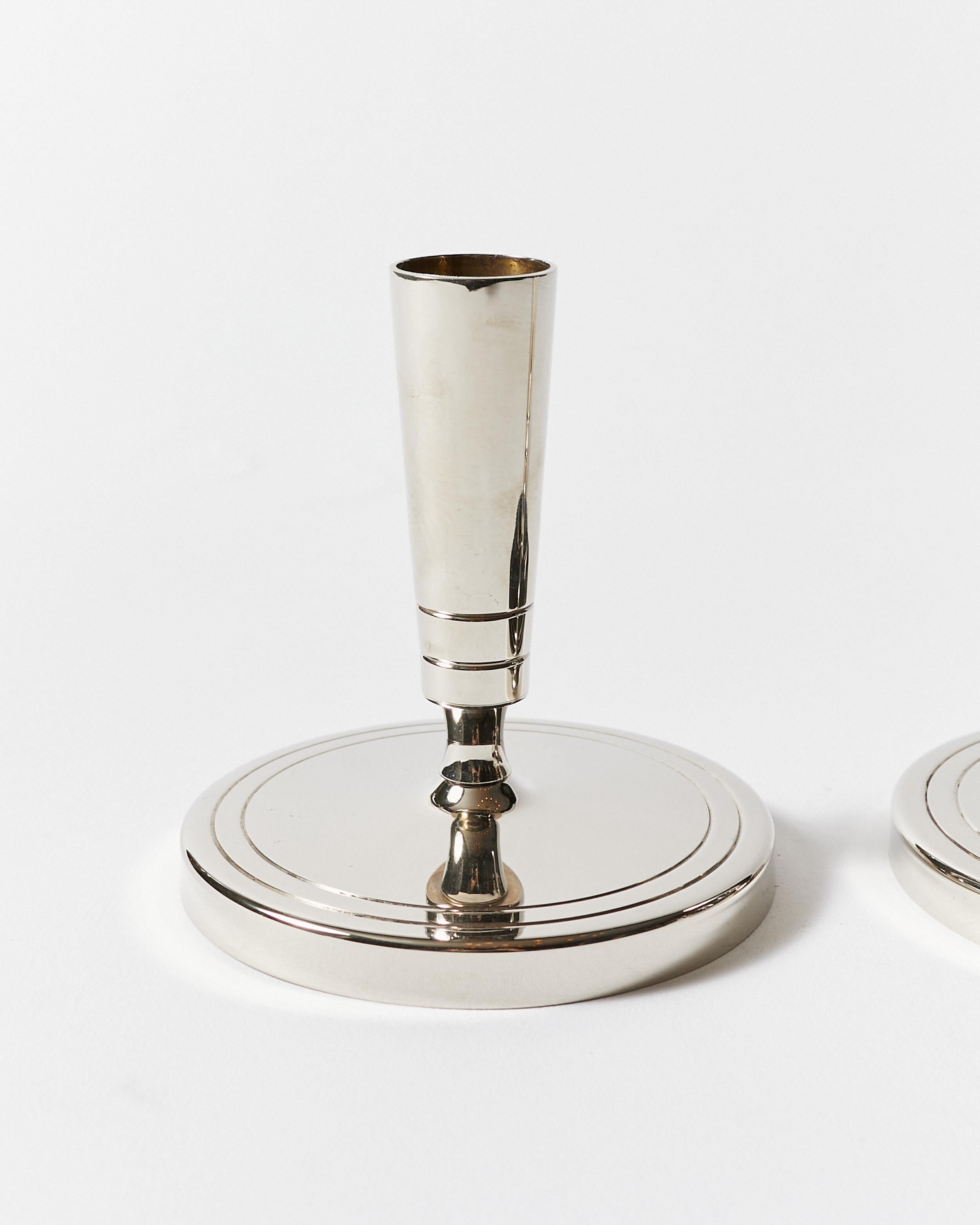 Polished Pair of Candlesticks by Tommi Parzinger for Dorlyn Silversmiths