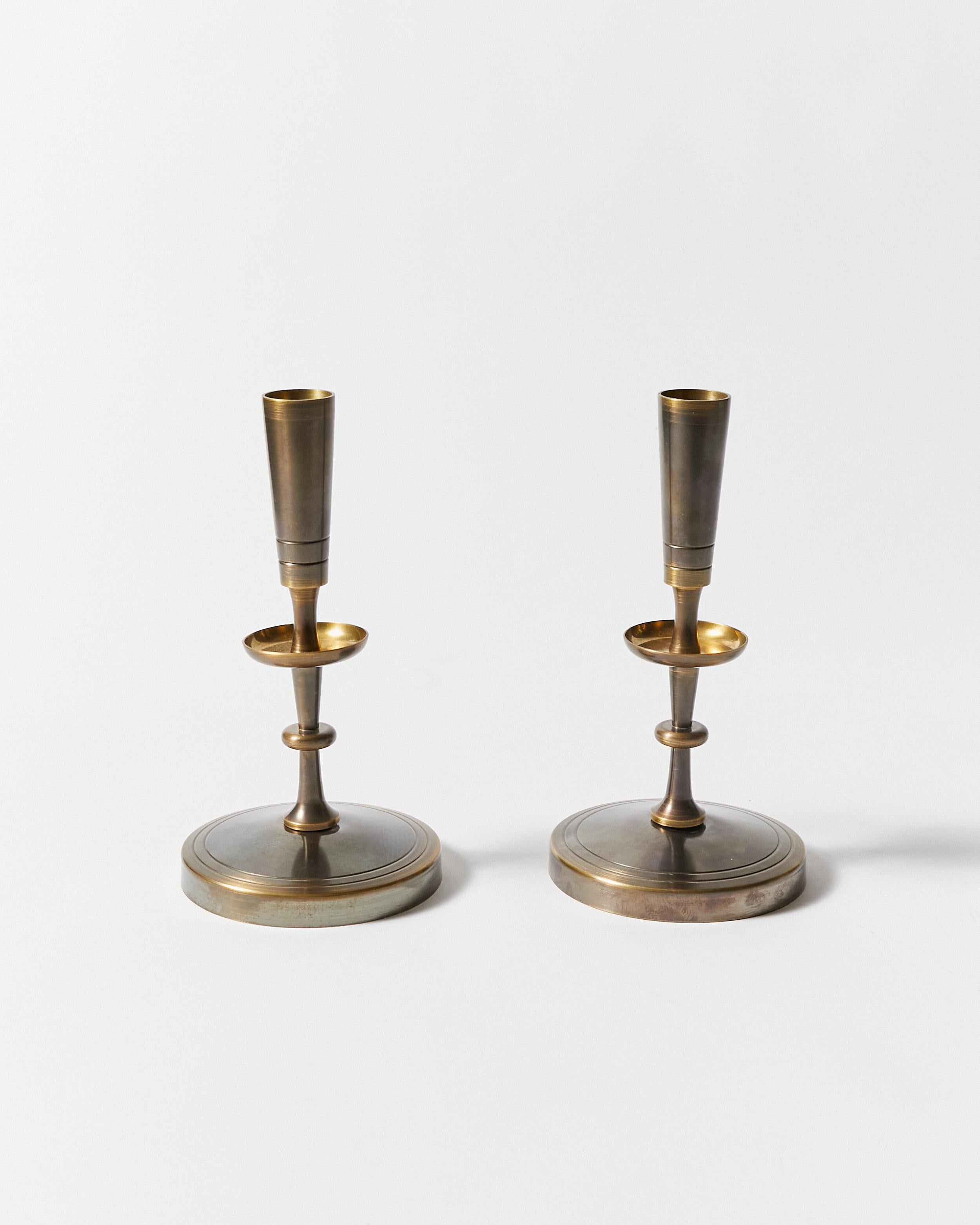 Set of two candlesticks re-finished in antique bronze. Designed by Tommy Parzinger for Dorlyn-Silversmiths.