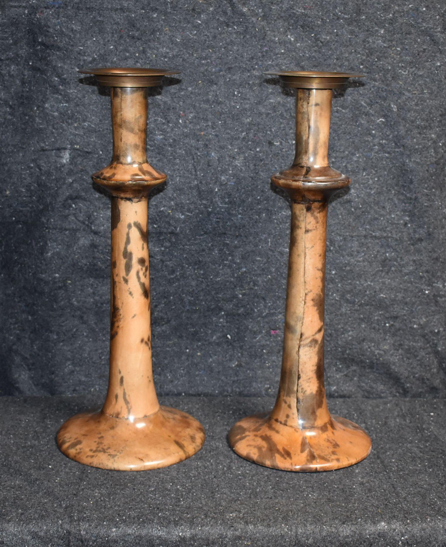 Pair of candleholders with antique brass finish top and goatskin.
Parchment is in varying shades of light and brown, beige, dark natural. (High gloss polyester resin filled finish).

Additional dimension:
Diameter of top 5.75 inches.