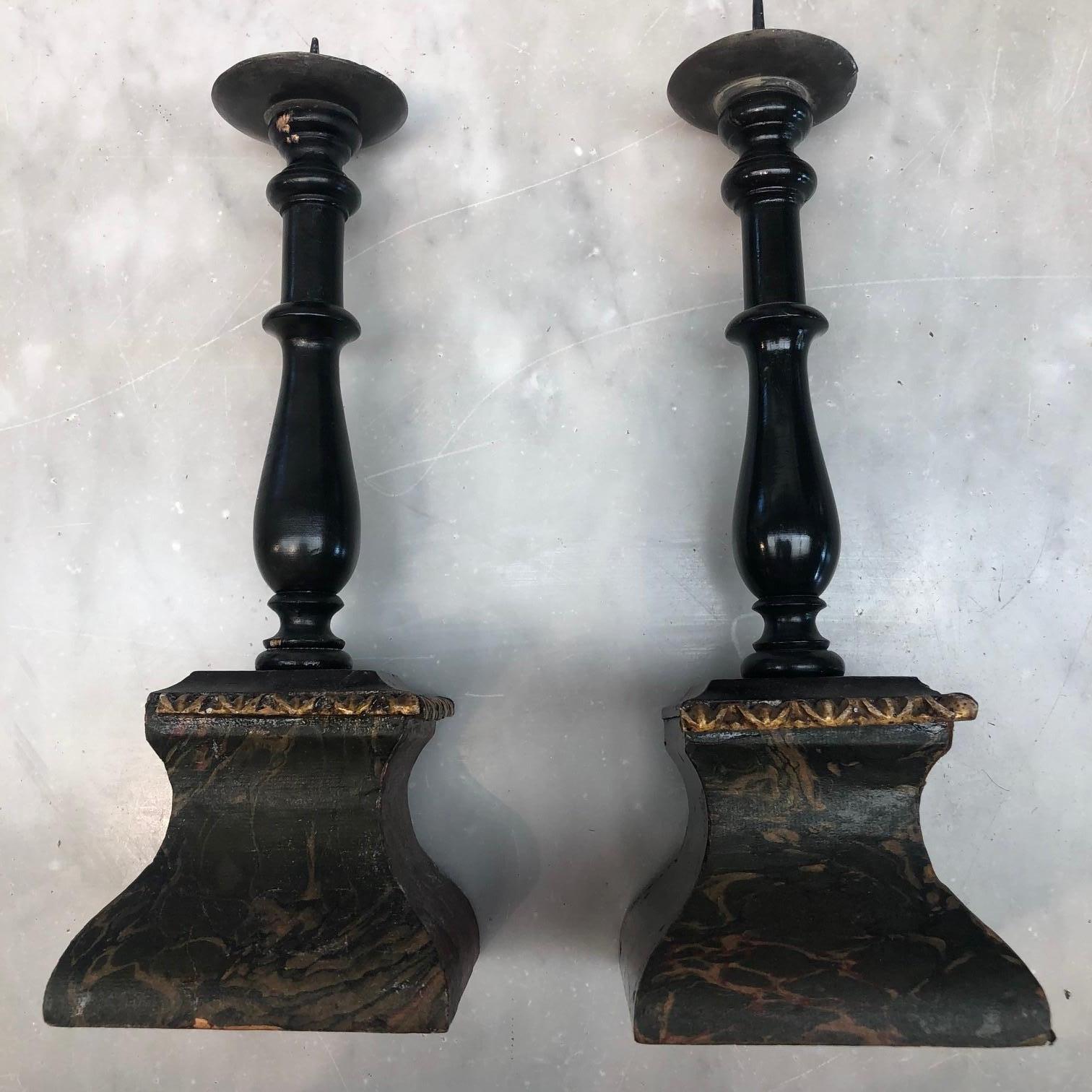 Pair of charming Danish Baroque candlesticks in wood with ebonized light stems, marble bases and pewter bobeches,
Denmark, circa 1750-1780.