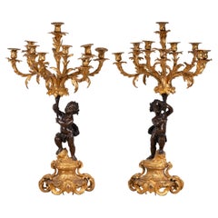 Pair of candlesticks. Gilt and blued bronze. France, 19th century.