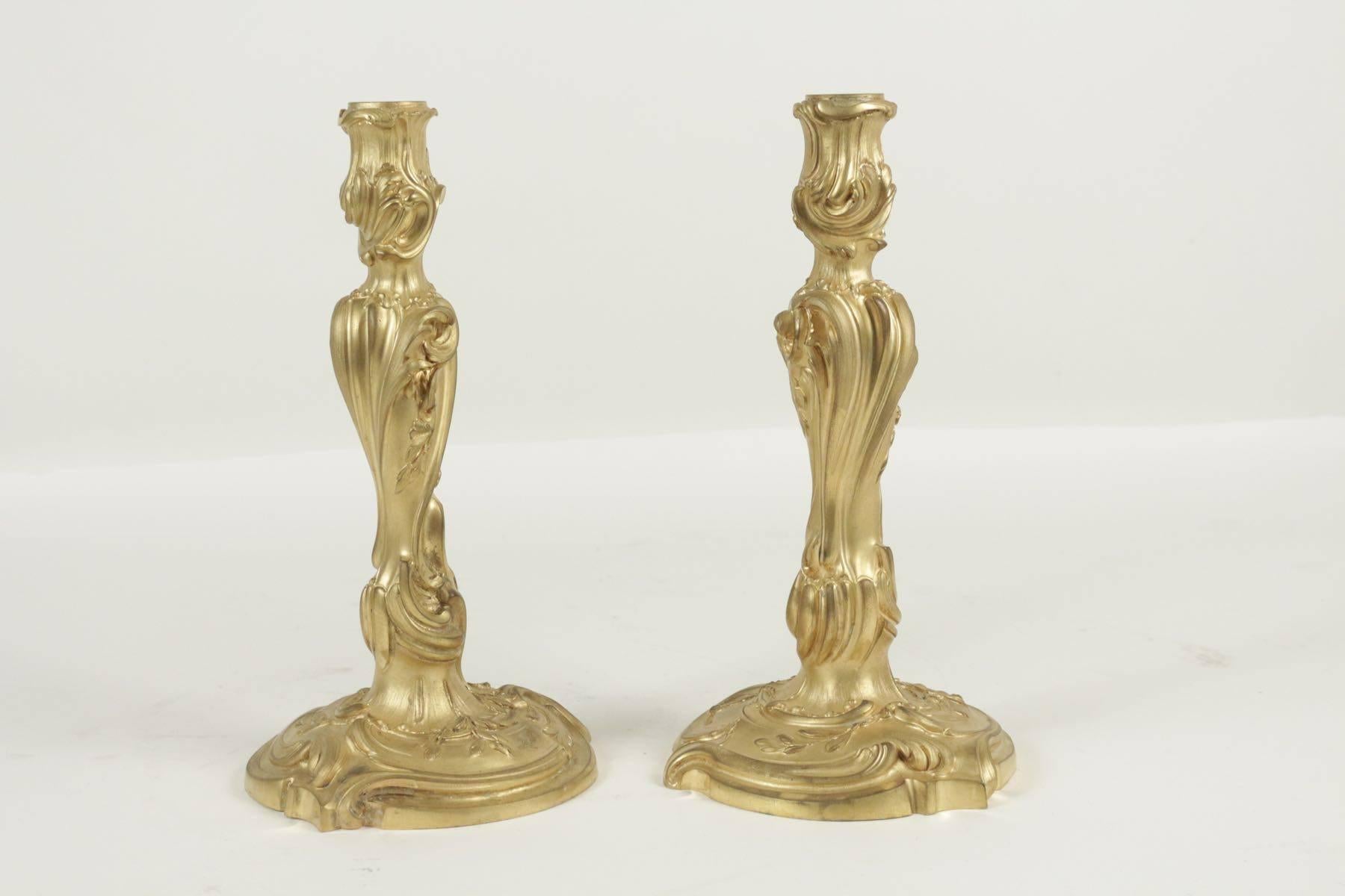 Pair of candlesticks in bronze from the 19th century in the Louis XV style.
 