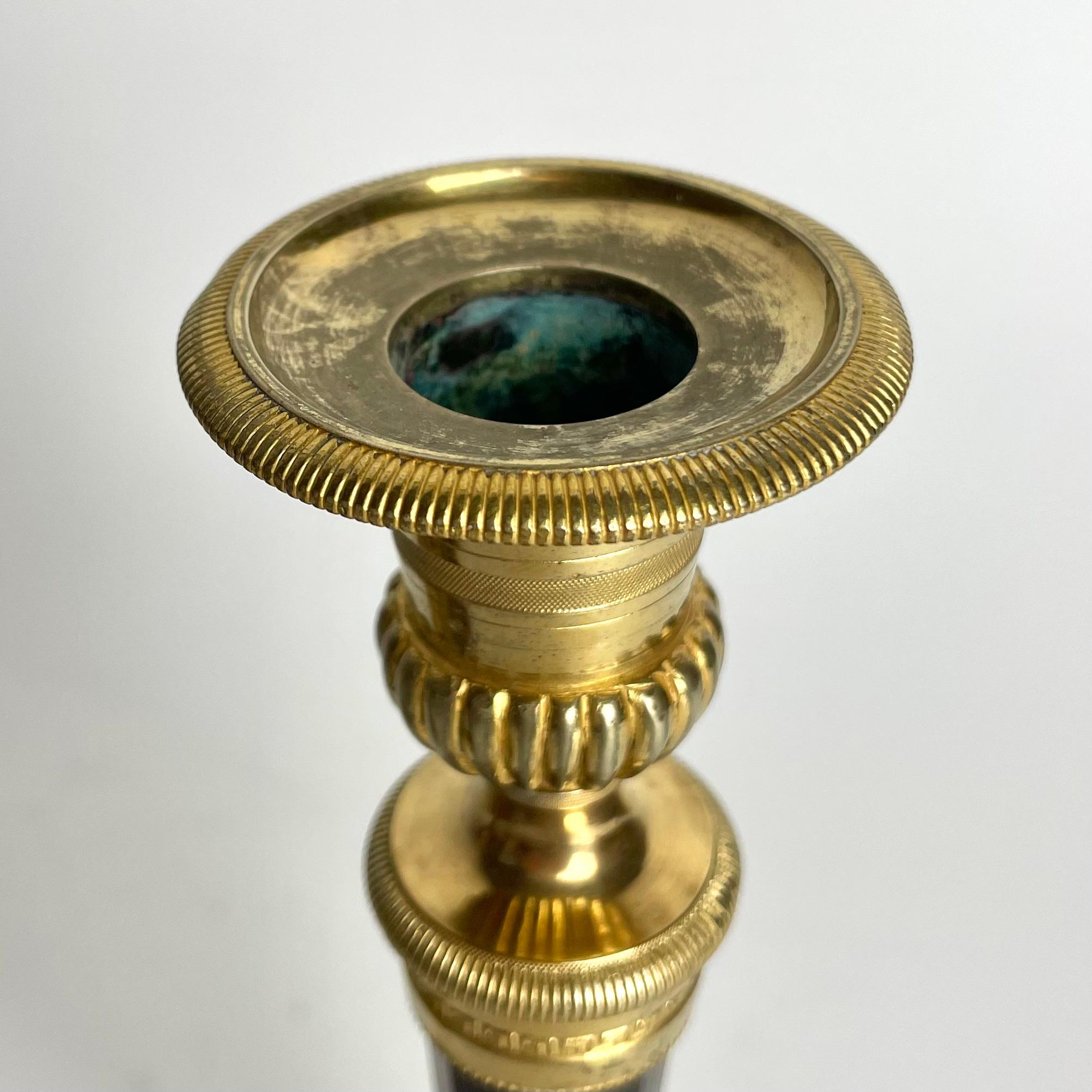 Pair of Candlesticks in gilded and darkpatinated bronze. Directoire circa 1795 For Sale 4