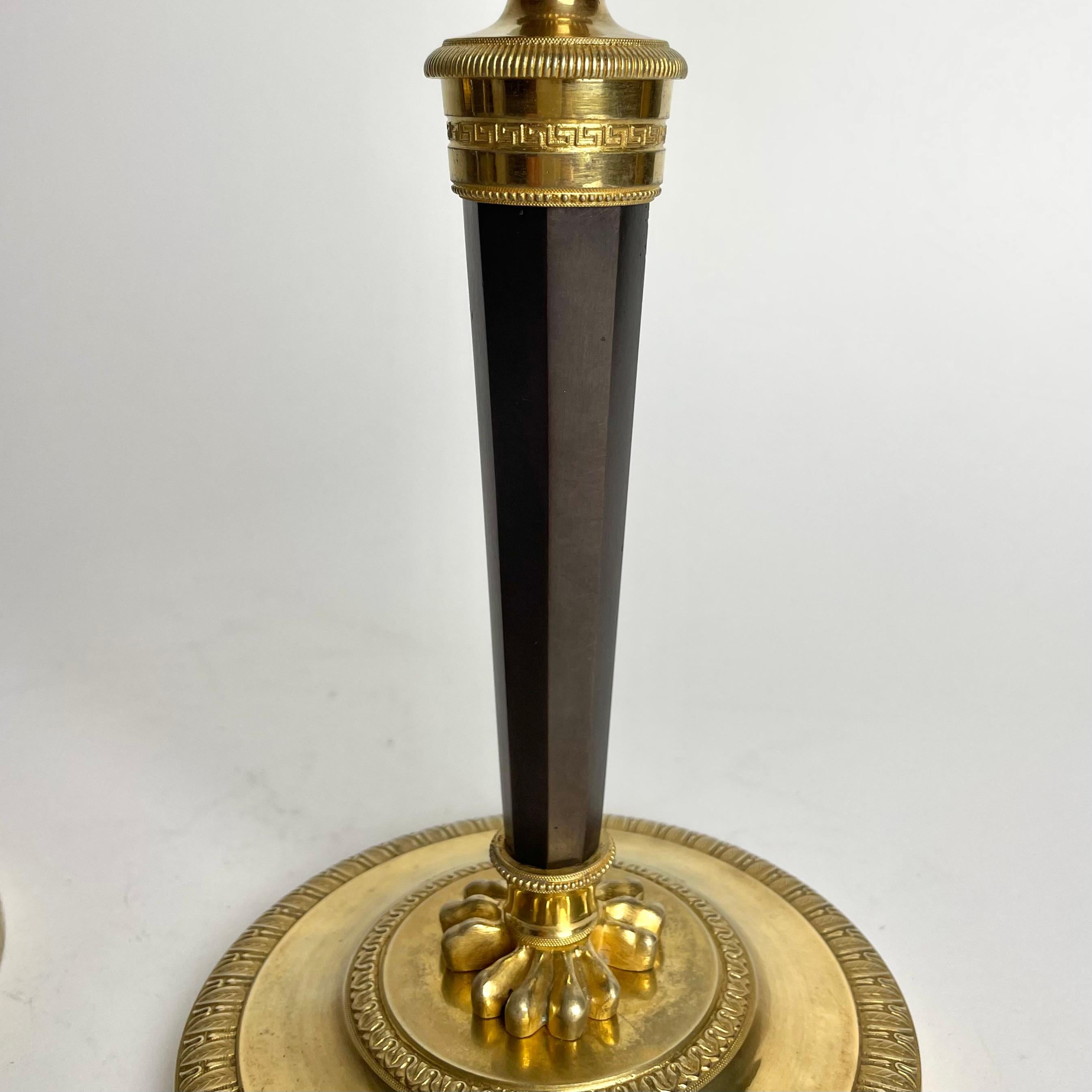 Pair of Candlesticks in gilded and darkpatinated bronze. Directoire circa 1795 For Sale 2