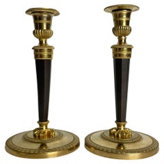 Paire de chandeliers en bronze doré et foncé patiné Directoire vers 1795
