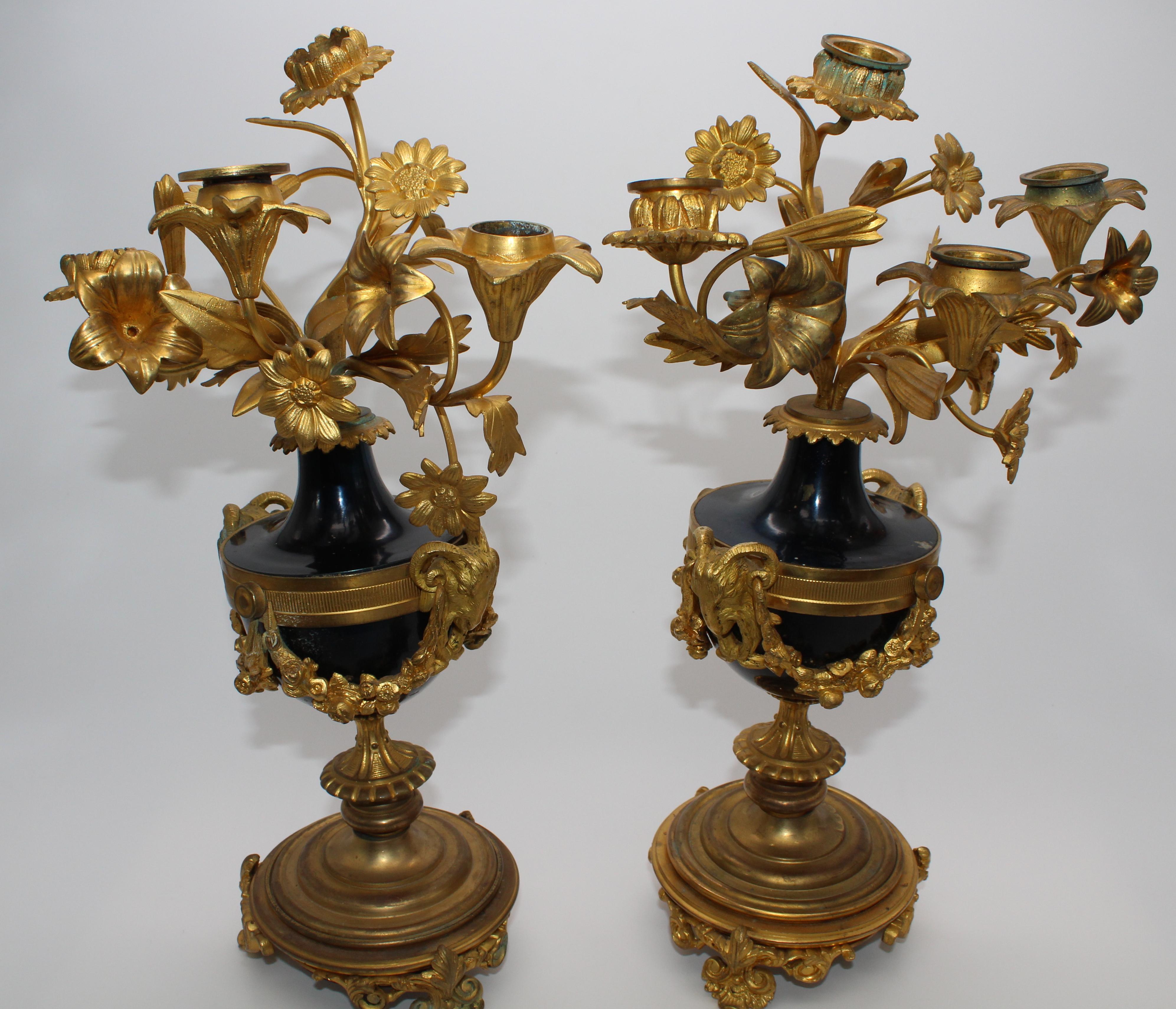 Pair of candlesticks in gilded bronze with 4 flames with Capricorn and blue enamel
made in France 19th century.