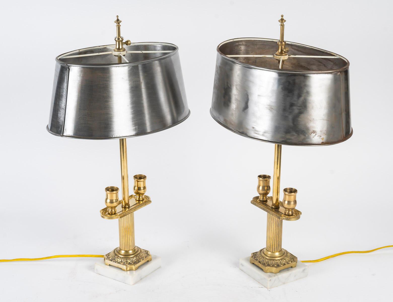 Pair of candlesticks mounted as table lamps, 19th century, Napoleon III period.

Pair of bronze candlesticks, marble base, steel shade, 19th century, Napoleon III period, 2 lights under the shade.
H: 48cm, W: 28cm, D: 17cm