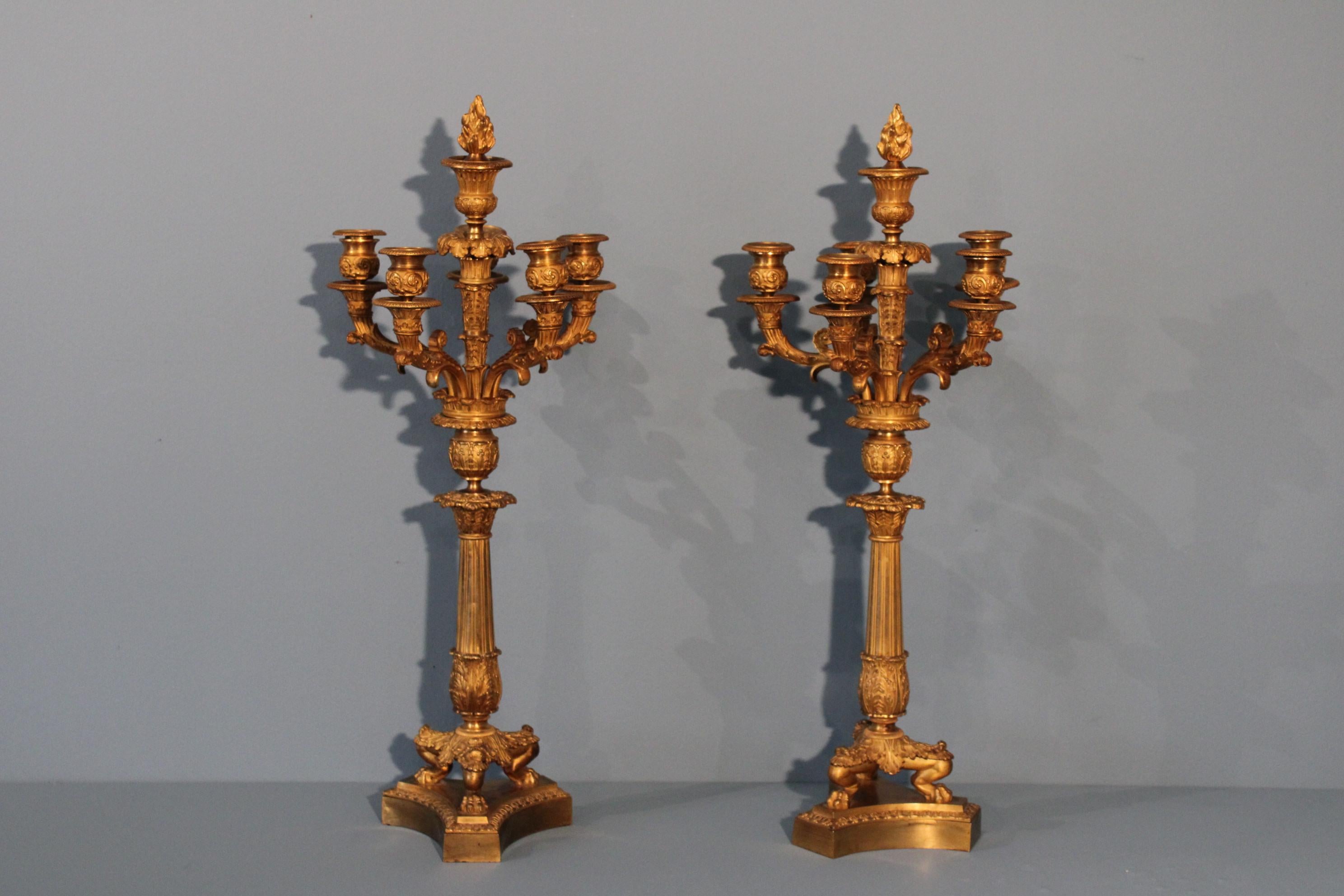 Pair of candlesticks in gilded bronze, Restauration period in France.