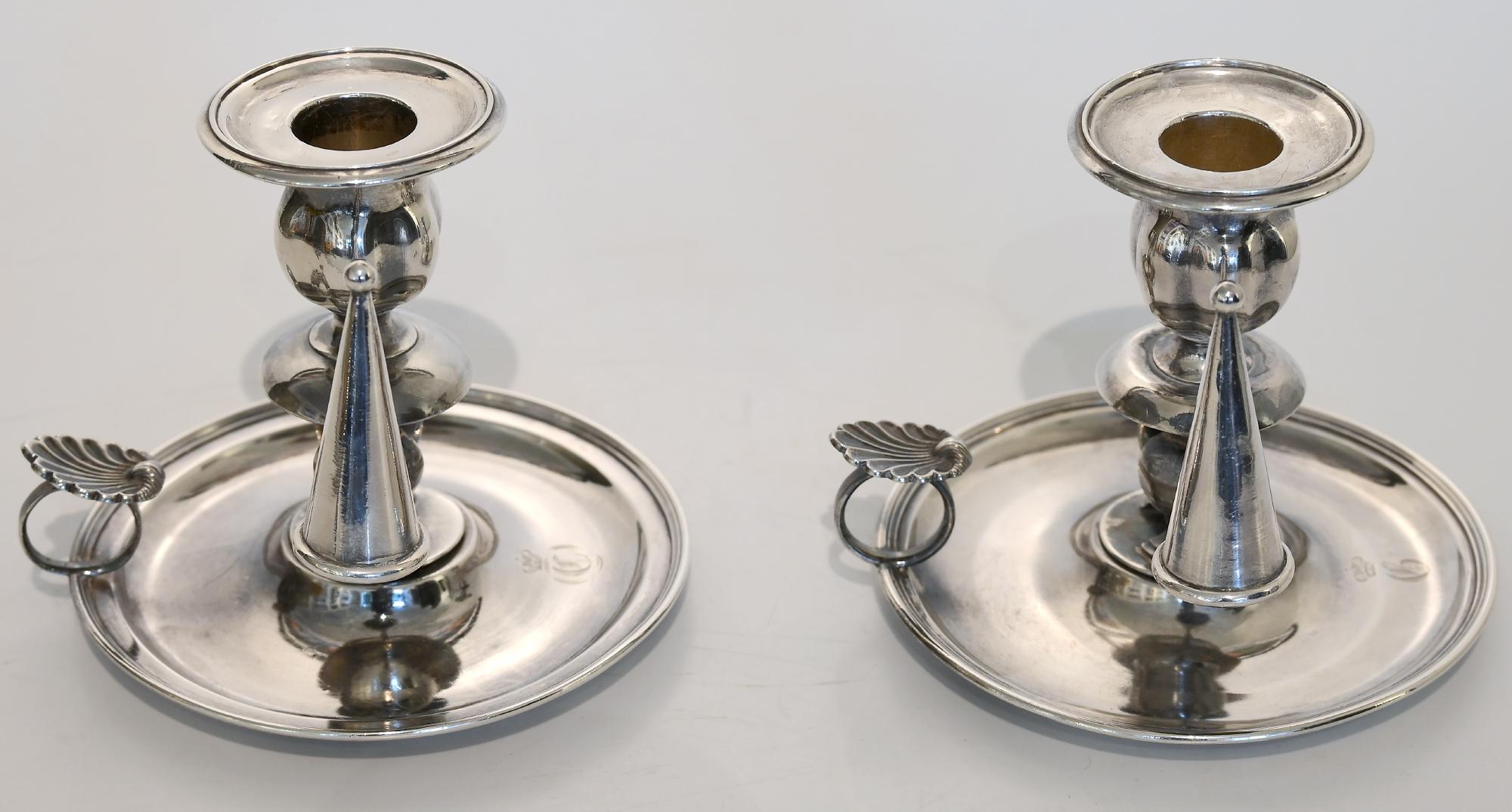 Pair of candlesticks, St. Petersburg Russia, dated 1854, with fire hat, makersmark, hallmark and monogram C T under crown from a noble family
the weight of the candlesticks are together 580 g silver.